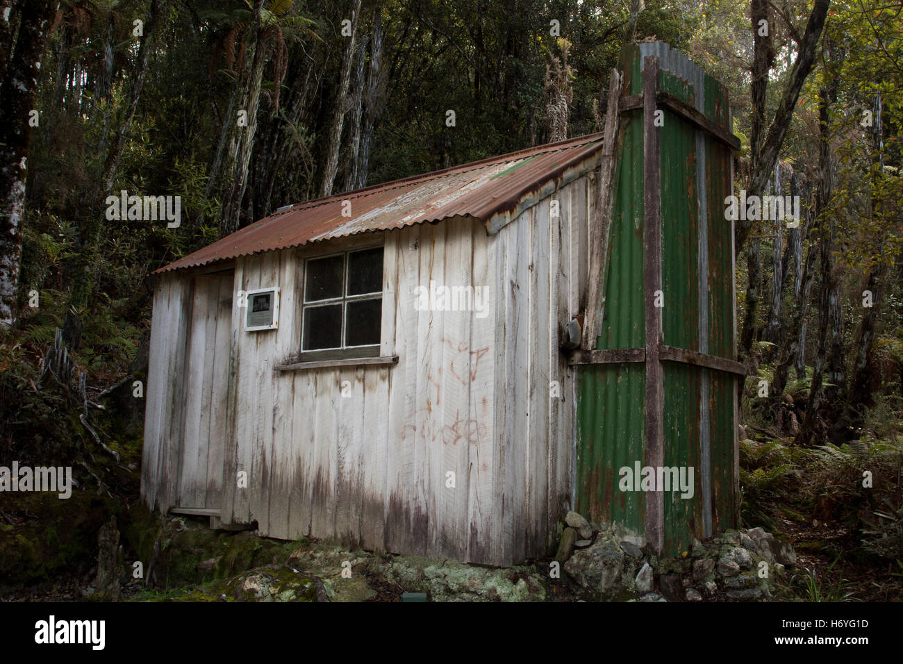 This miner's cottage in  Ross is a reminiscent of half a century of goldmining near the town Ross on New Zealand's South Island. Stock Photo