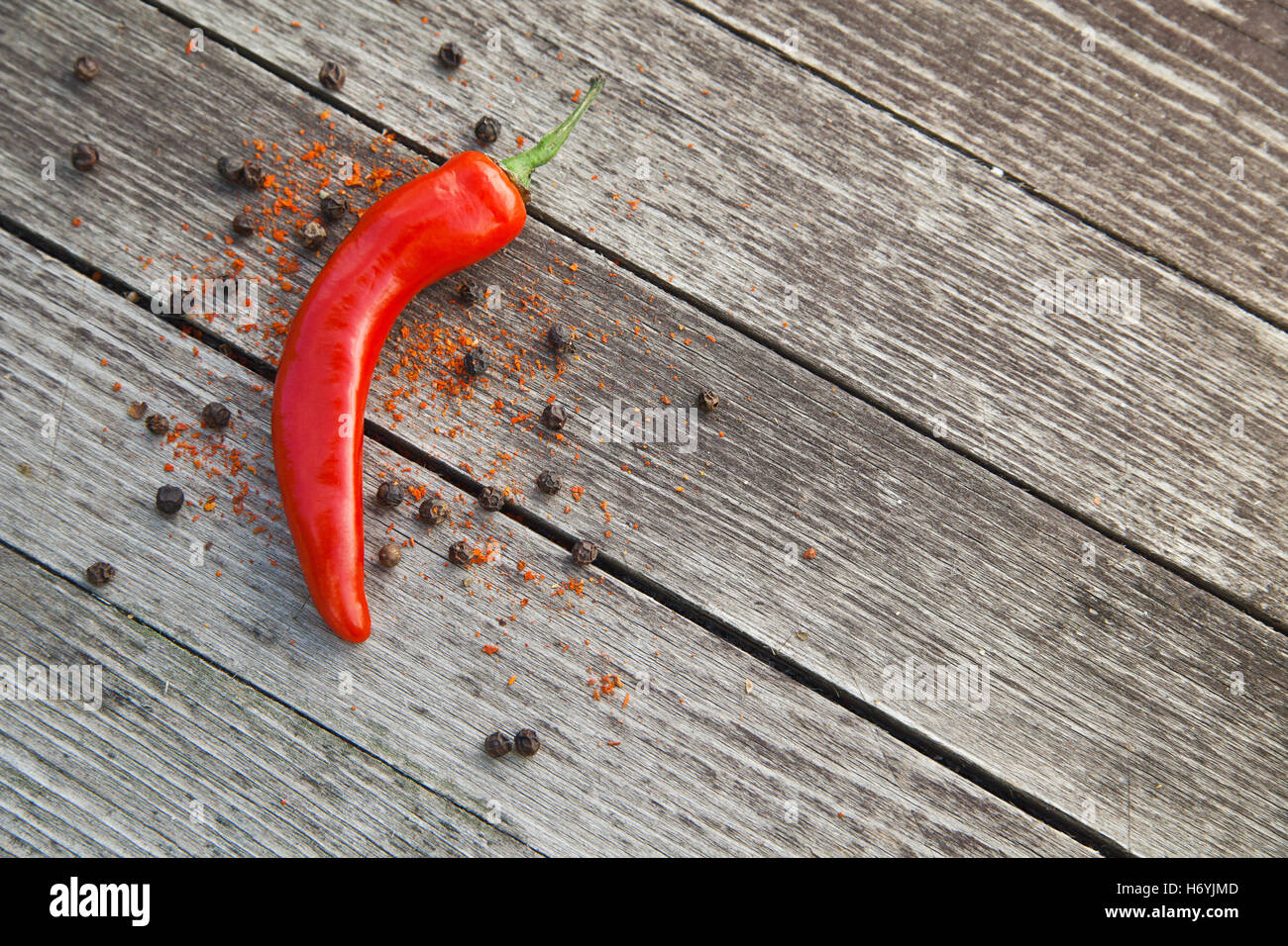 Red hot chili peppers on wood Stock Photo - Alamy