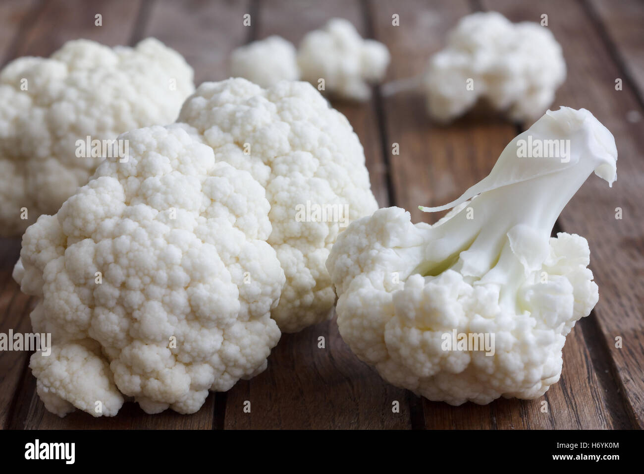 Fresh cauliflower florets on a dark wood board Stock Photo Alamy