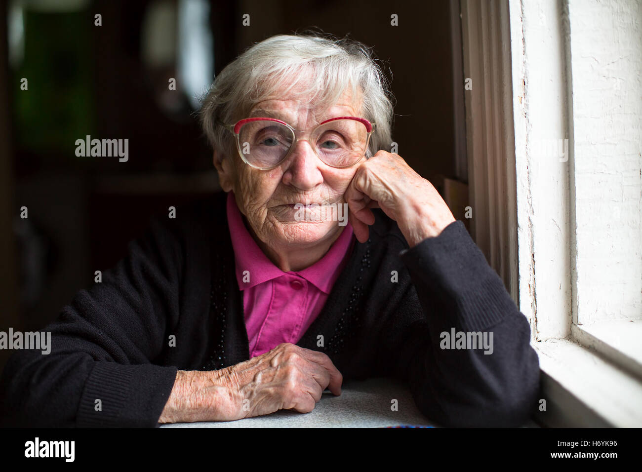 Portrait of elderly woman with glasses. Stock Photo