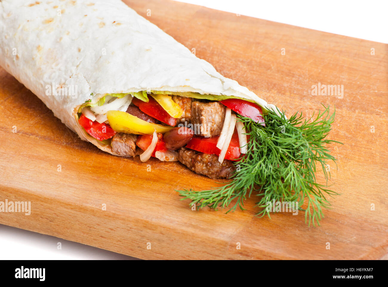 beef burrito with peppers, onion and tomato Stock Photo Alamy