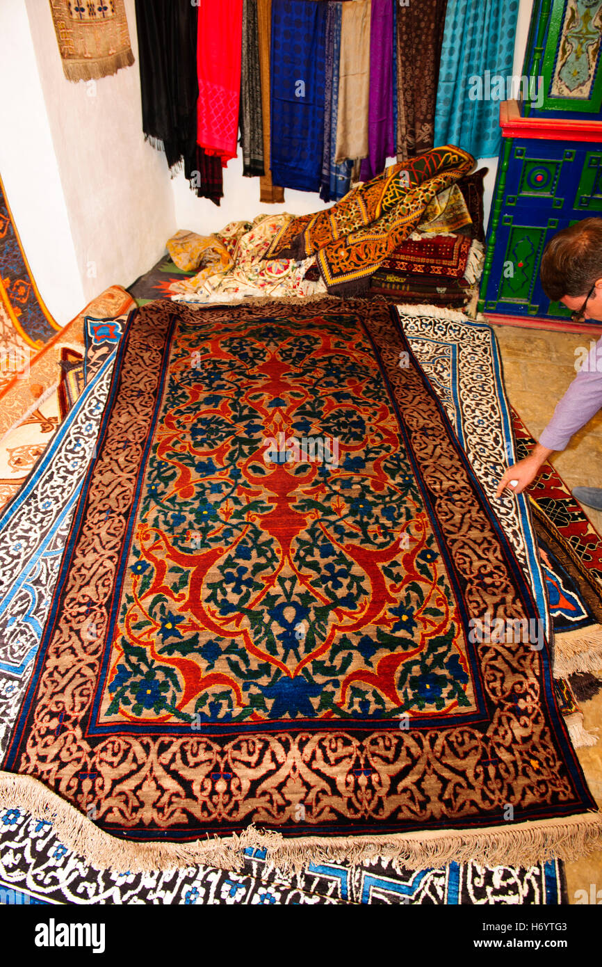Khiva Silk Workshops,colorful, Suzanas,throws,bed spreads,silk carpets,women at work,Silk Road,Khorezm Province,Uzbekistan Stock Photo