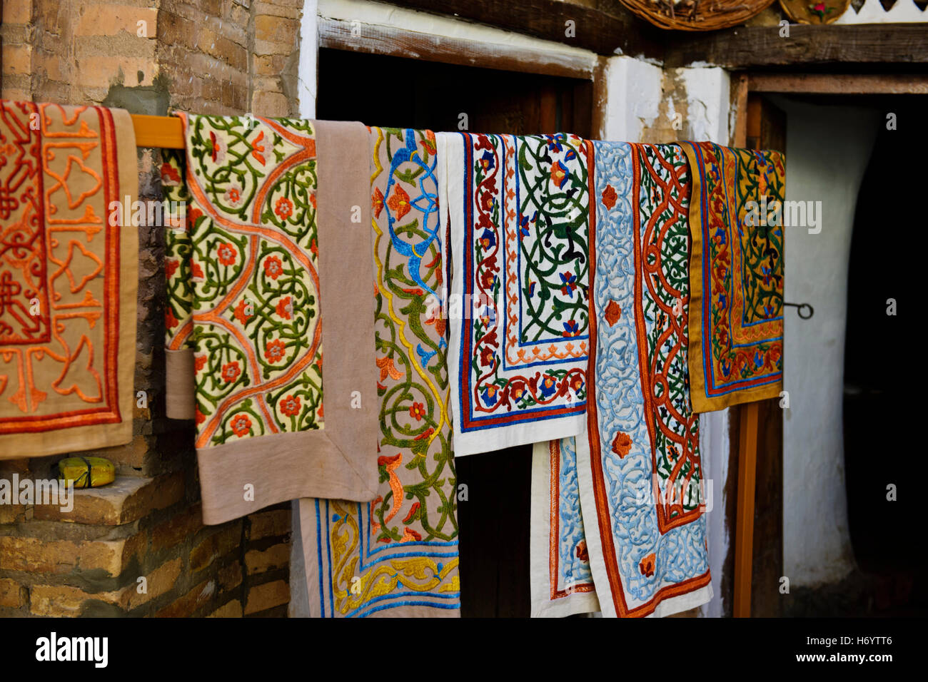 Khiva Silk Workshops,colorful, Suzanas,throws,bed spreads,silk carpets,women at work,Silk Road,Khorezm Province,Uzbekistan Stock Photo