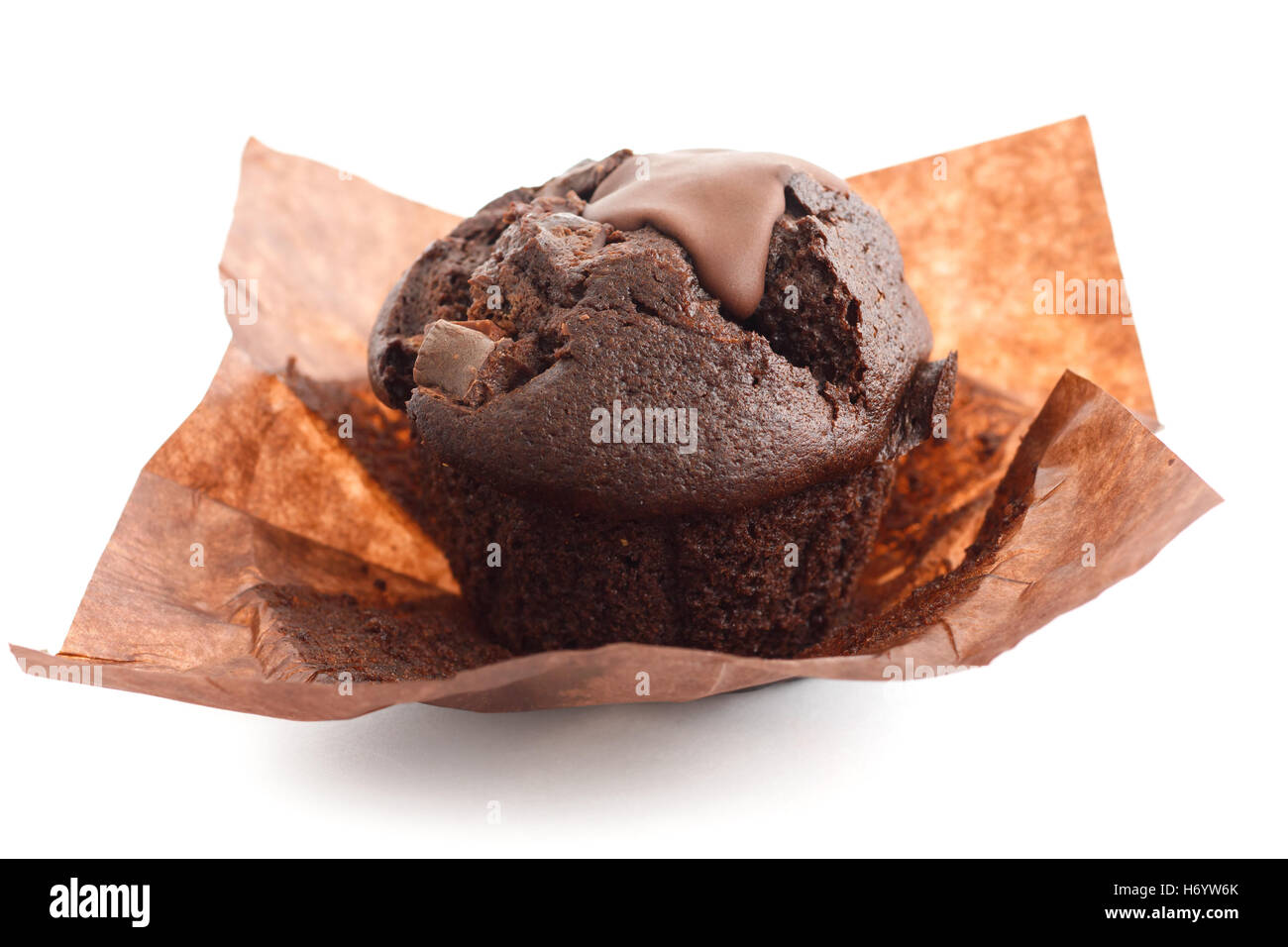 Chocolate chip muffin in brown wax paper. Unwrapped. Stock Photo