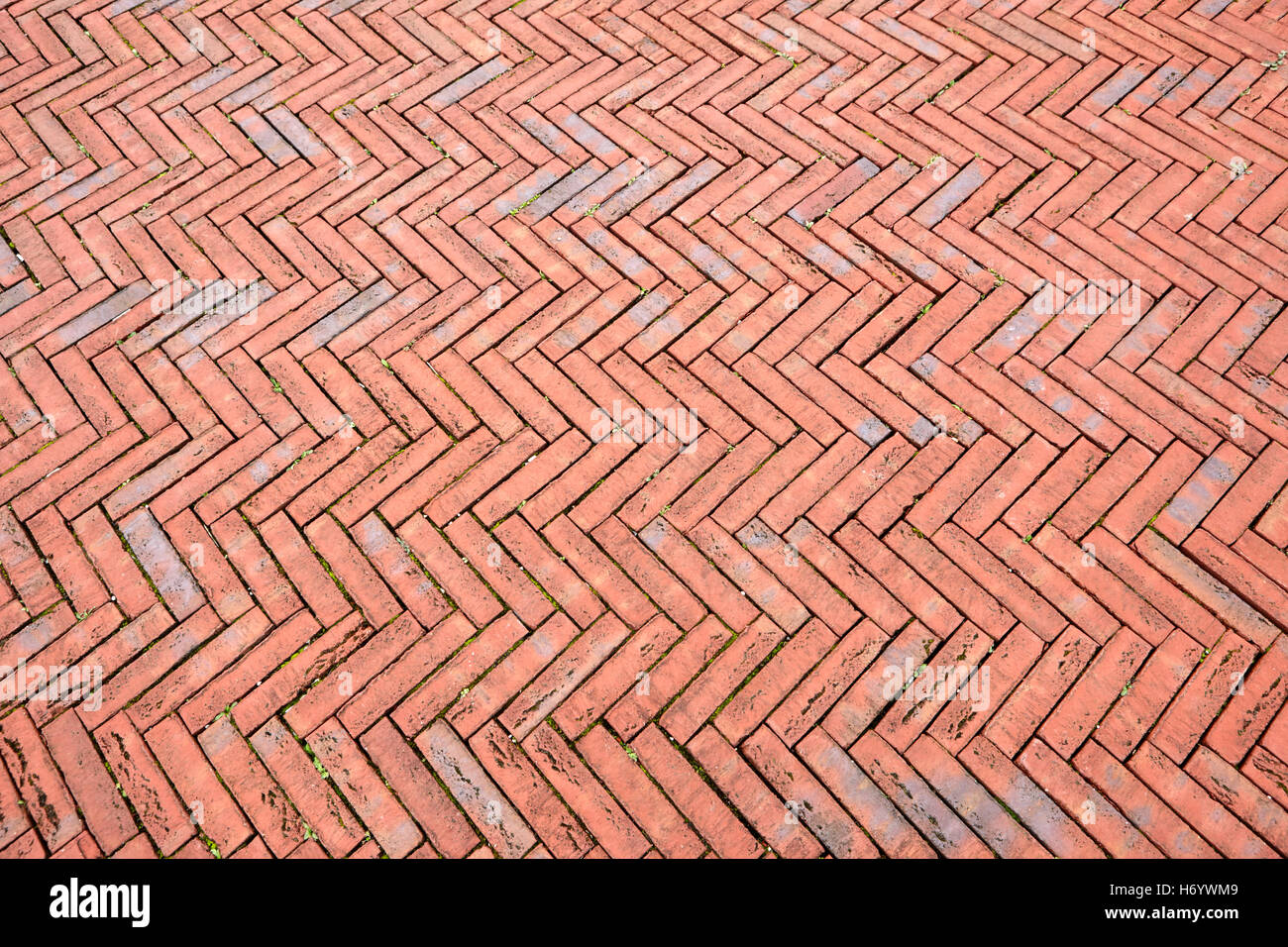 herringbone pattern red brick paving in Cardiff bay Wales United Kingdom Stock Photo