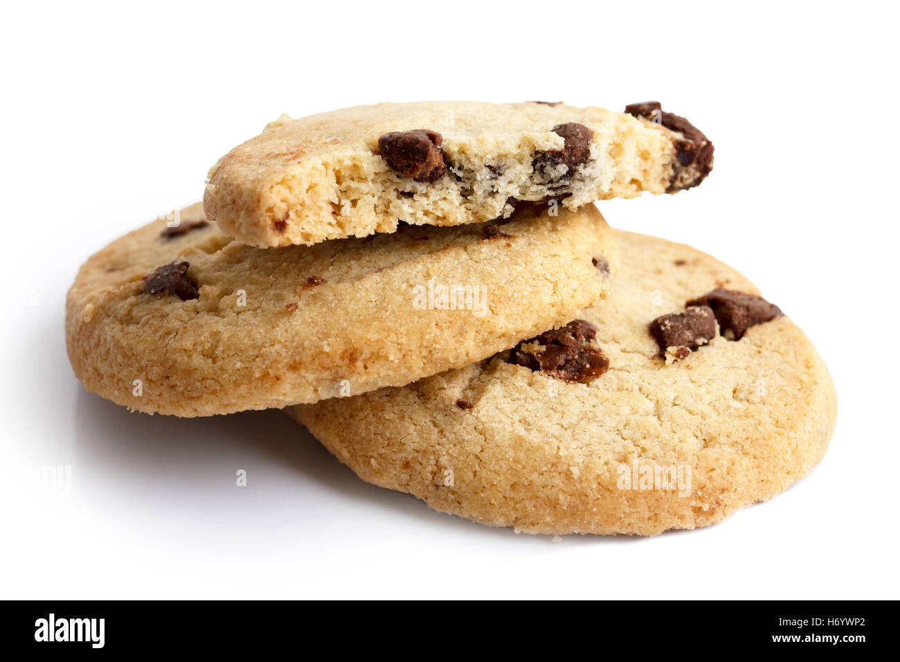Isolated round chocolate chip shortbread biscuits. Broken piece. Stock Photo