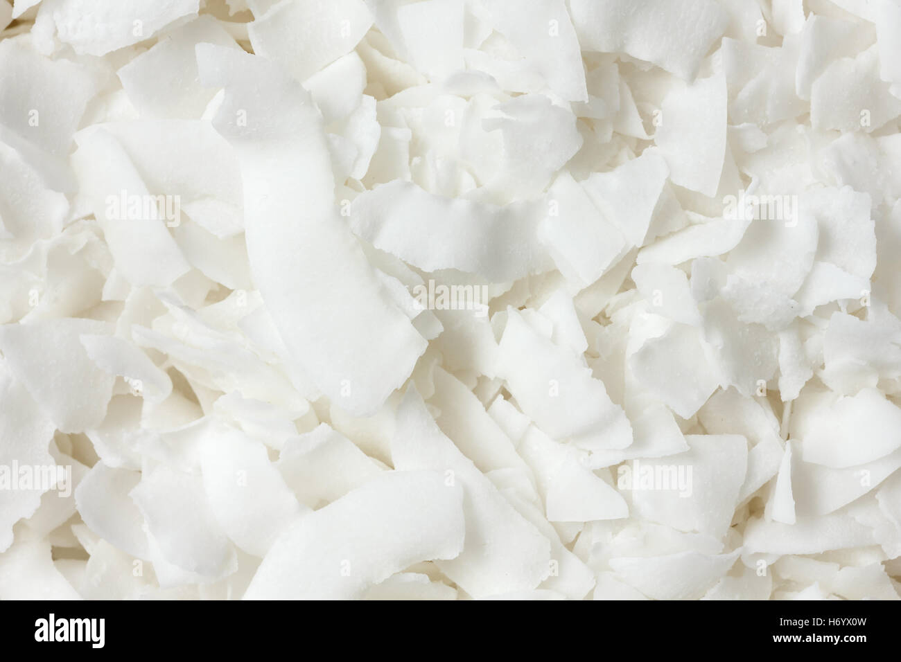 Detail of dried shaved coconut flakes. From above. Stock Photo