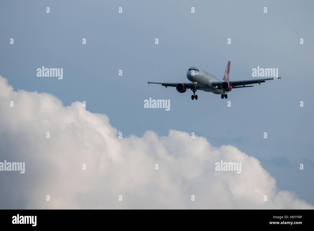 Massachusetts, Boston. Virgin Airlines jet flying into Boston Logan airport. Stock Photo