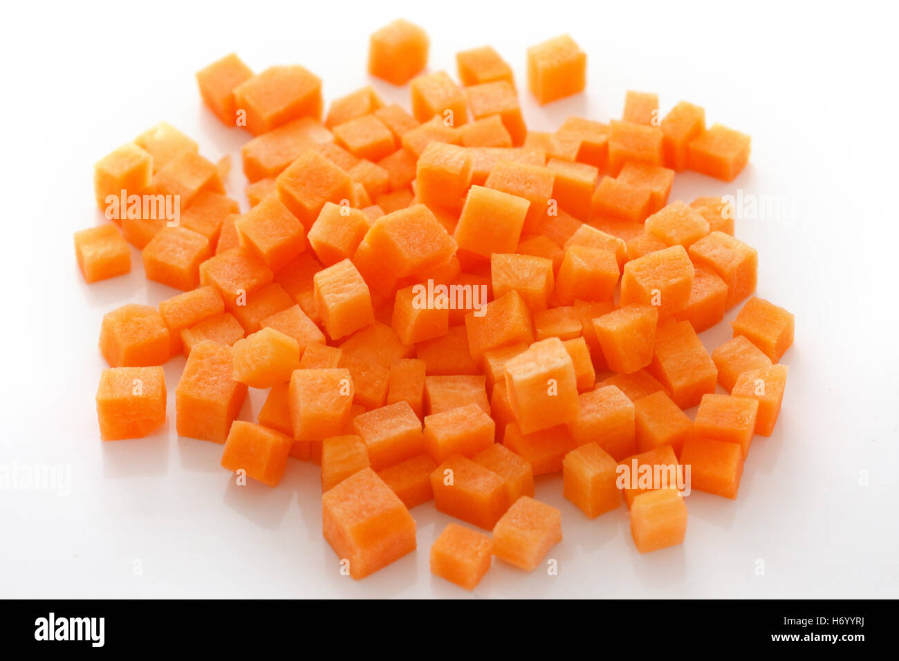 Diced carrots on white Stock Photo