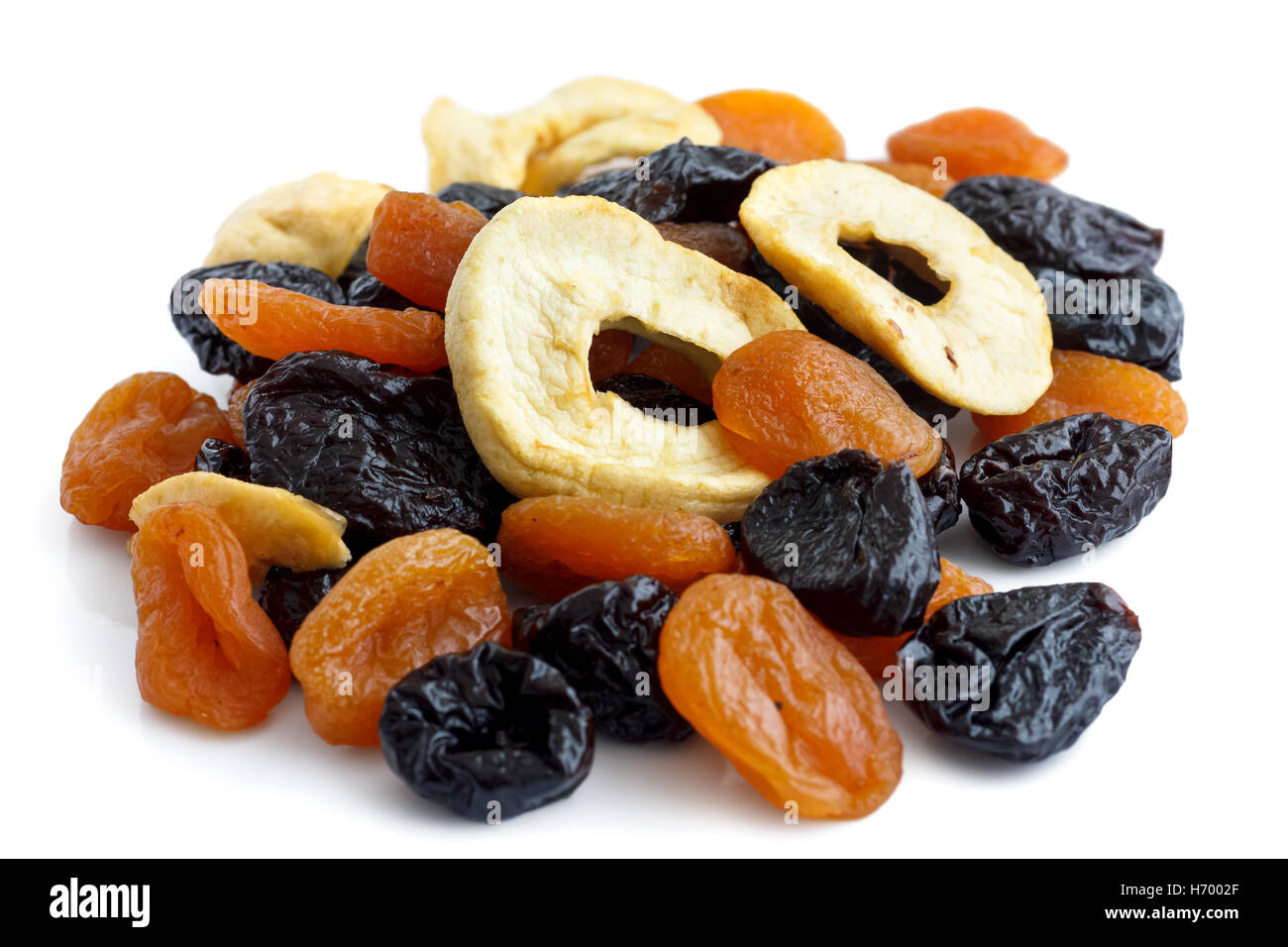 Pile of mixed dried fruit isolated on white. In perspective. Stock Photo