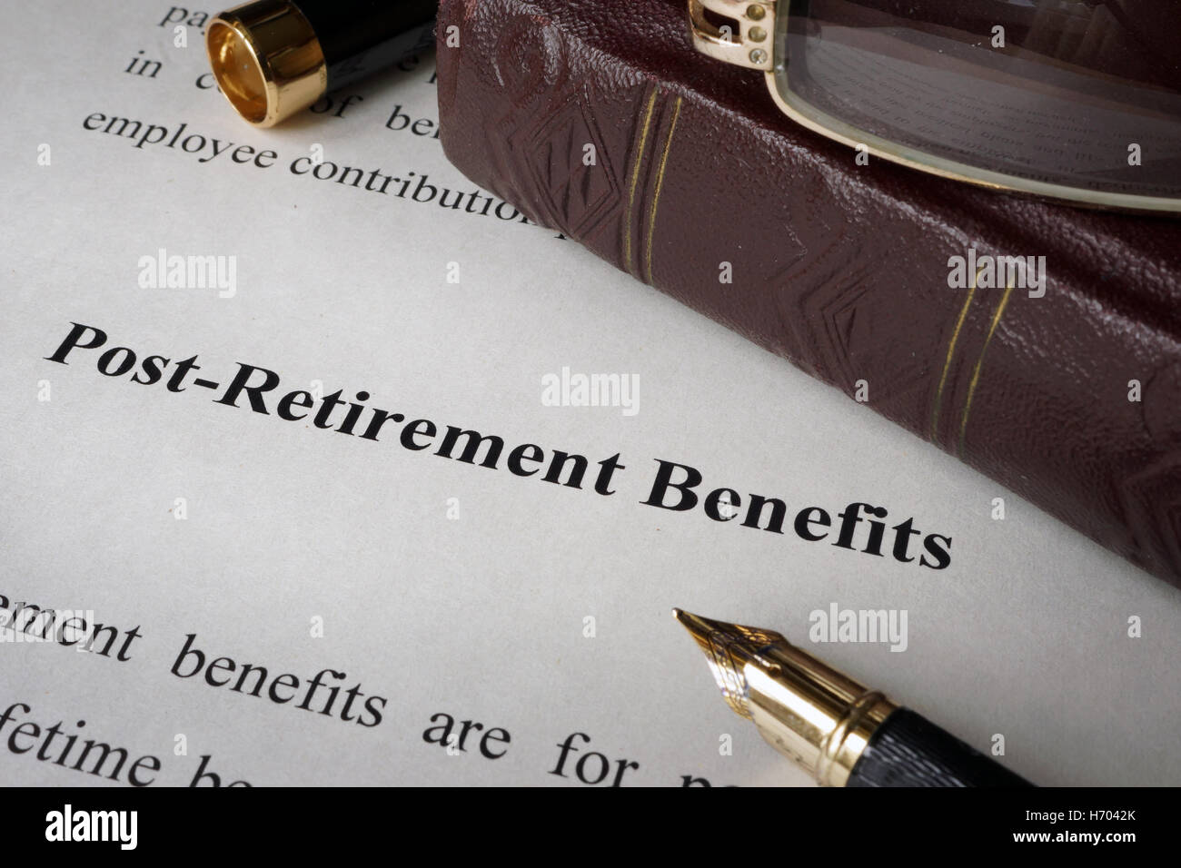 Postretirement benefit on a sheet on a office table Stock Photo Alamy