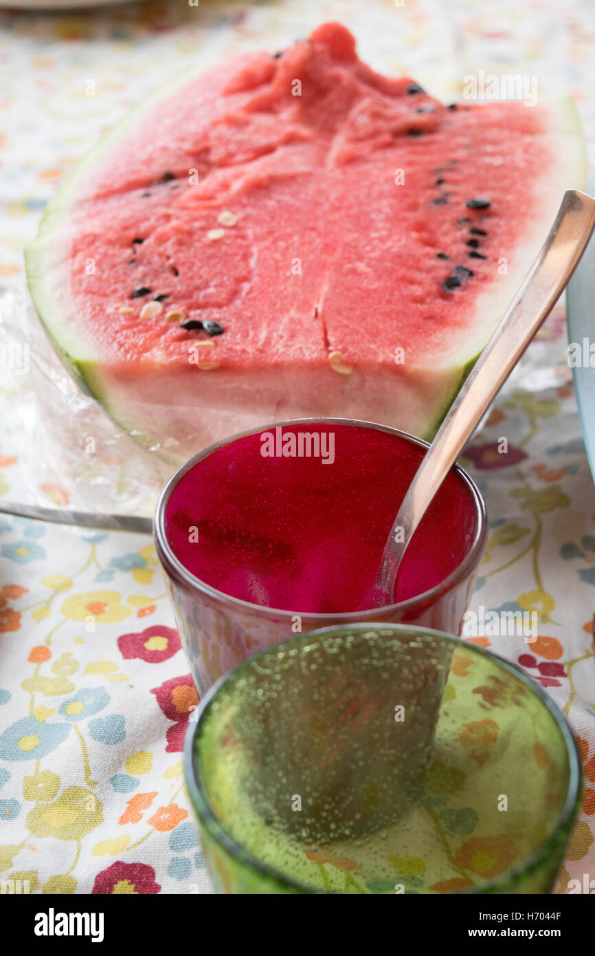 ripe watermelon on a table at end of the lunch Stock Photo