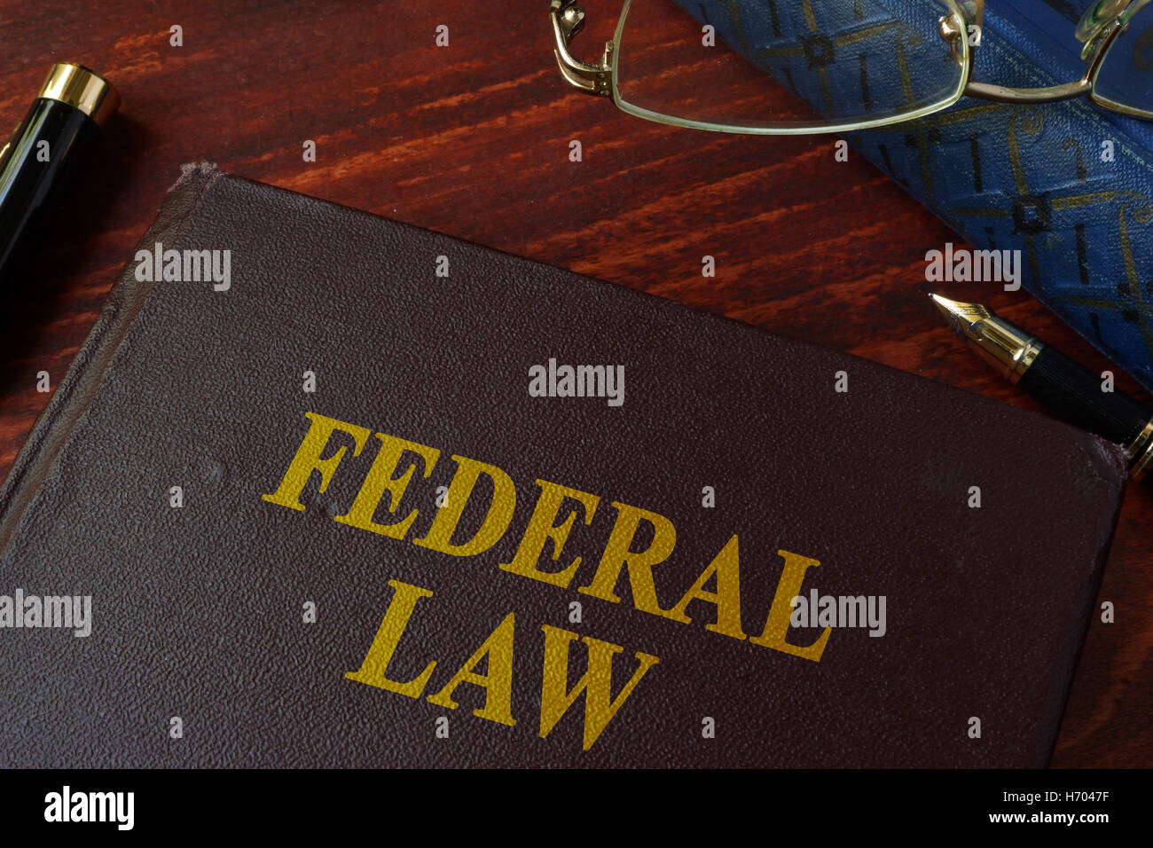 Book with title federal law on a table. Stock Photo