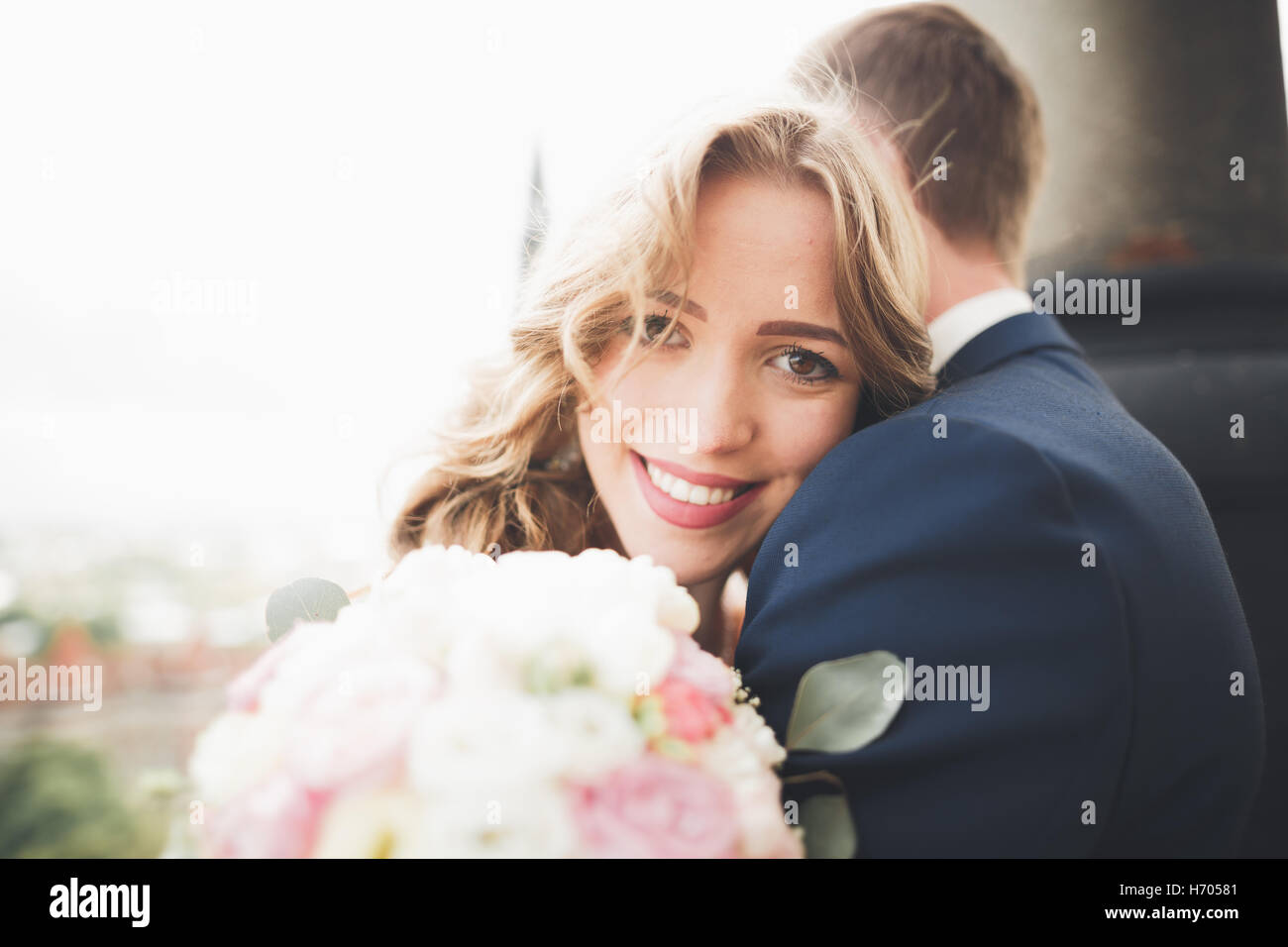 Stylish Beautiful Wedding Couple Kissing And Hugging On Background Panoramic View Of The Old 