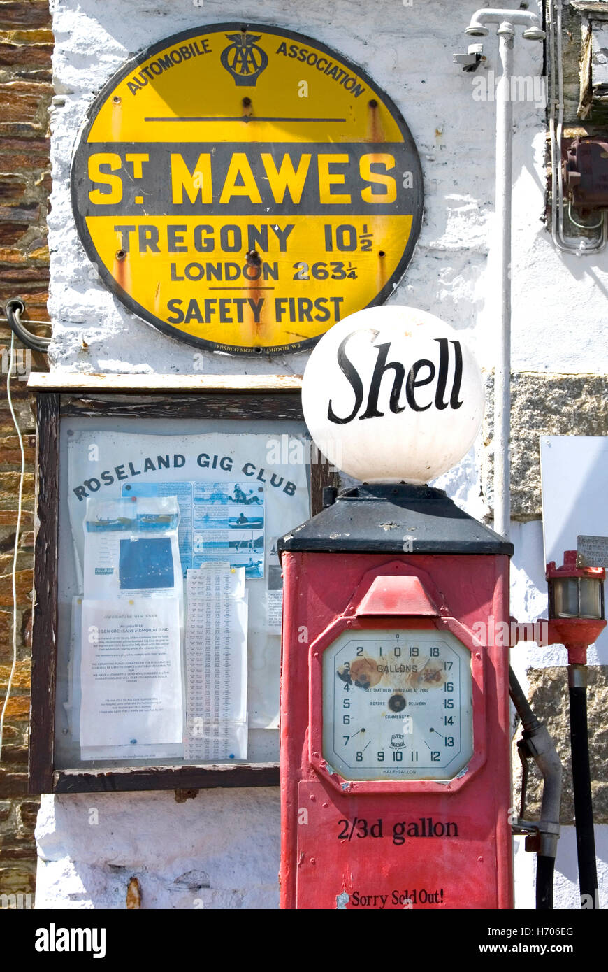 St Mawes historical old Cornish petrol filling station AA sign Shell petrol pump displaying old money shilling penny price gallon Cornwall England UK Stock Photo