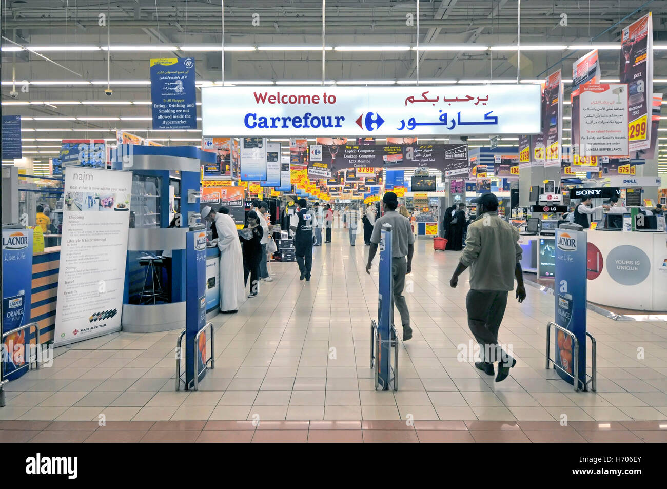 Middle East UAE Abu Dhabi Carrefour supermarket store shopping with  multilingual bilingual signs located beneath Abu Dhabi Marina arab shopping  mall Stock Photo - Alamy
