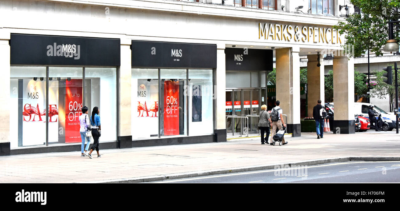 Oxford Street shopping mecca with shop front windows and pavement of Marks and Spencer London West End flagship M&S store in London England UK Stock Photo