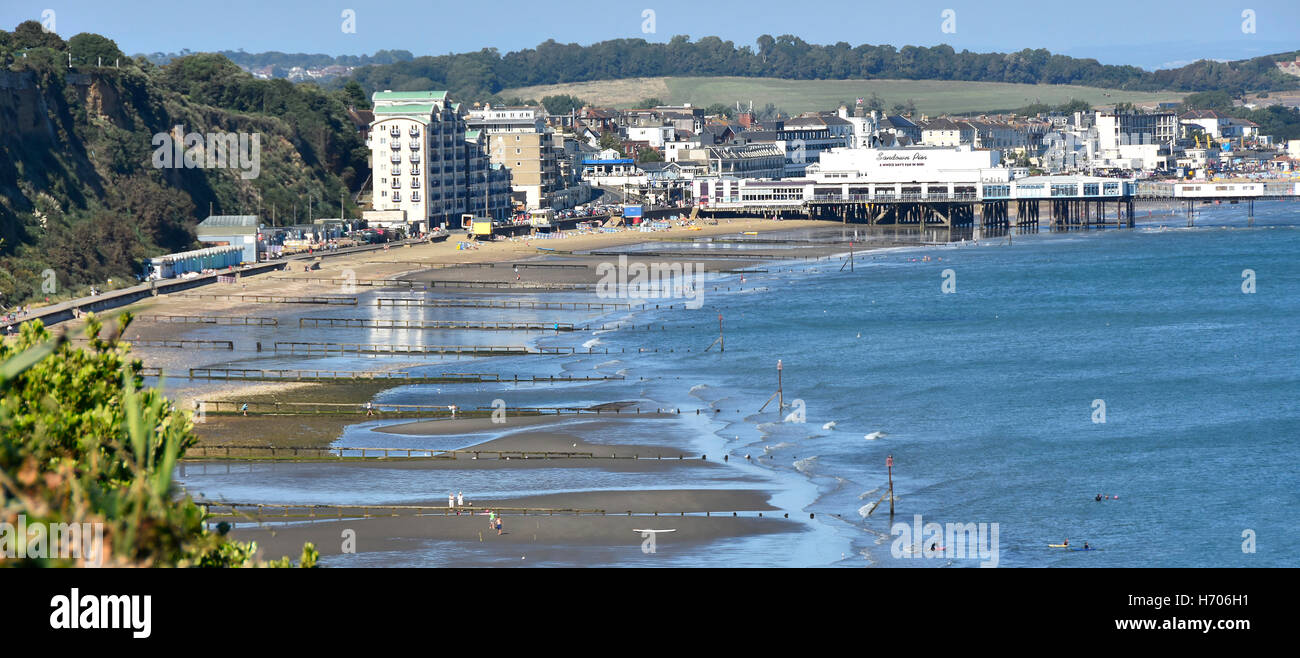 View from above British seaside beach holiday resort Sandown Pier Isle of Wight low tide sea breakwaters & groins England uk on blue sky day summer Stock Photo