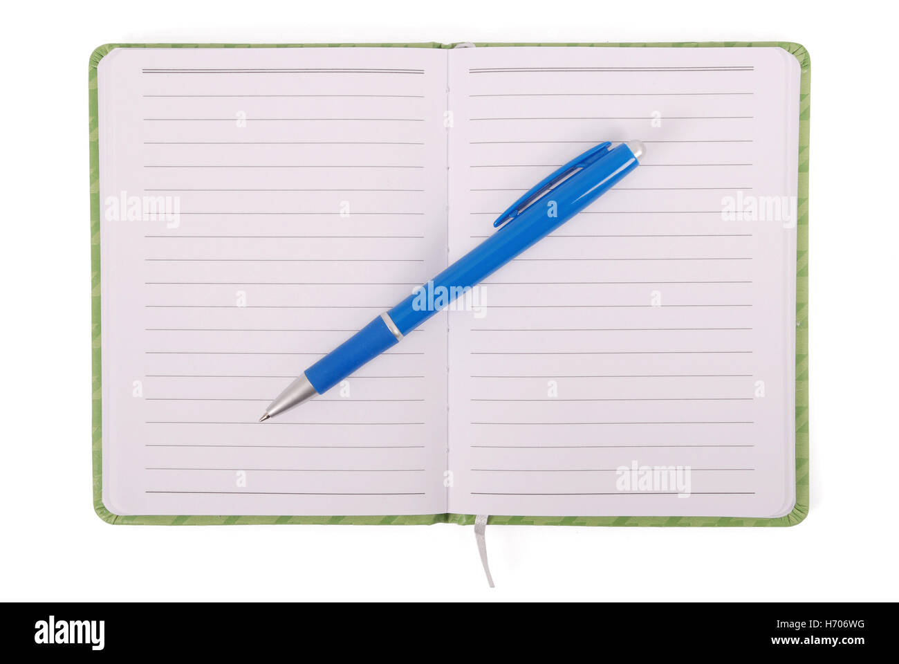 Green notebook with blue pen isolated on white background with soft shadow (Clipping path) Stock Photo
