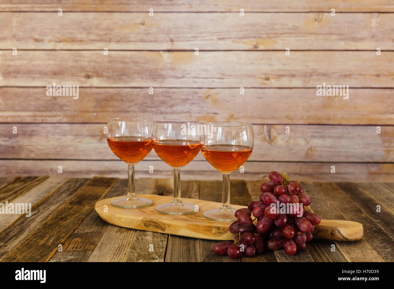 Rose wine flight with grapes Stock Photo Alamy