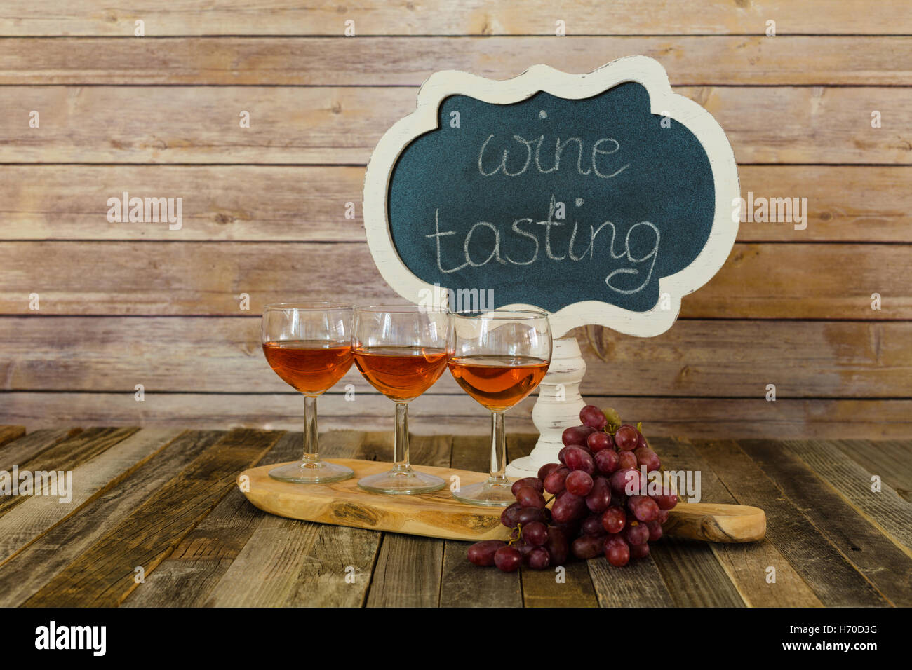 Rose wine flight with chalkboard sign and grapes Stock Photo Alamy