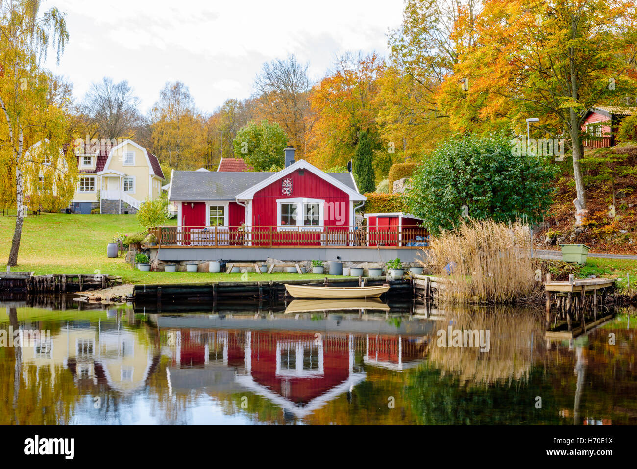 Bokevik, Sweden - October 25, 2016: Environmental documentary of coastal lifestyle. Seaside home with private pier and a small r Stock Photo