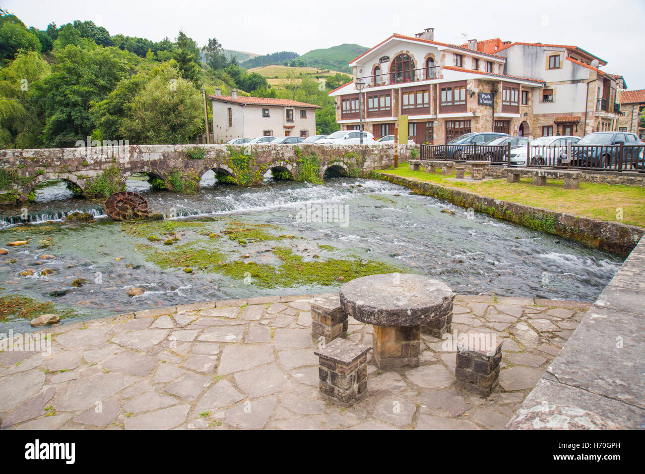 Stone bridge over La Fuentona river. Ruente, Cantabria, Spain. Stock Photo