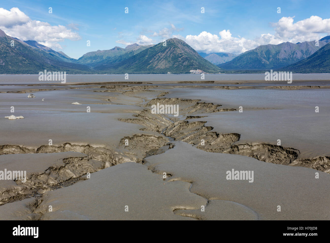 Tidal mudflats of Turnagain Arm looking toward the Chugach Mountains from Hope in Southcentral Alaska. Stock Photo