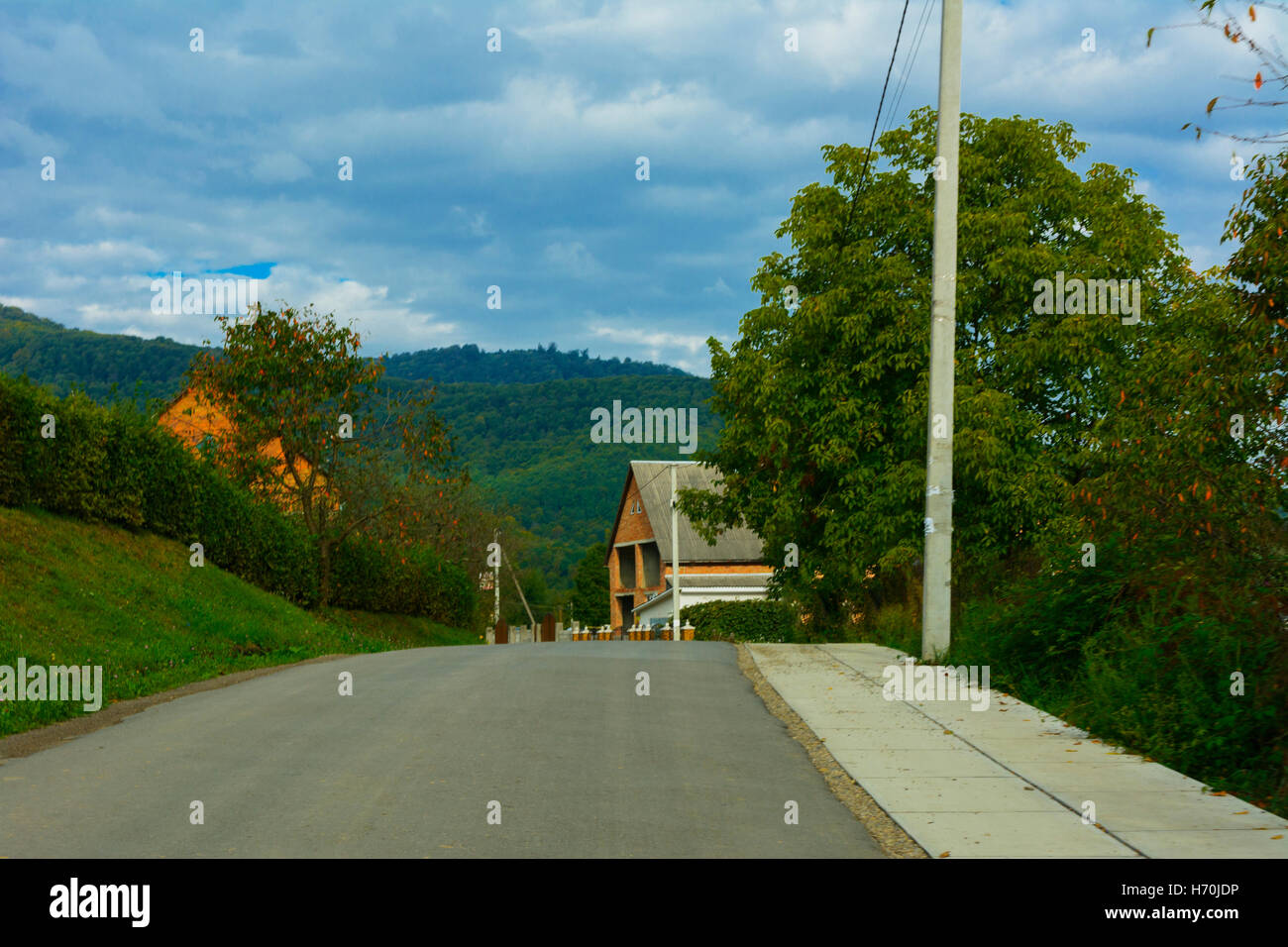 Mountain road. The landscape of fields and mountains Stock Photo - Alamy