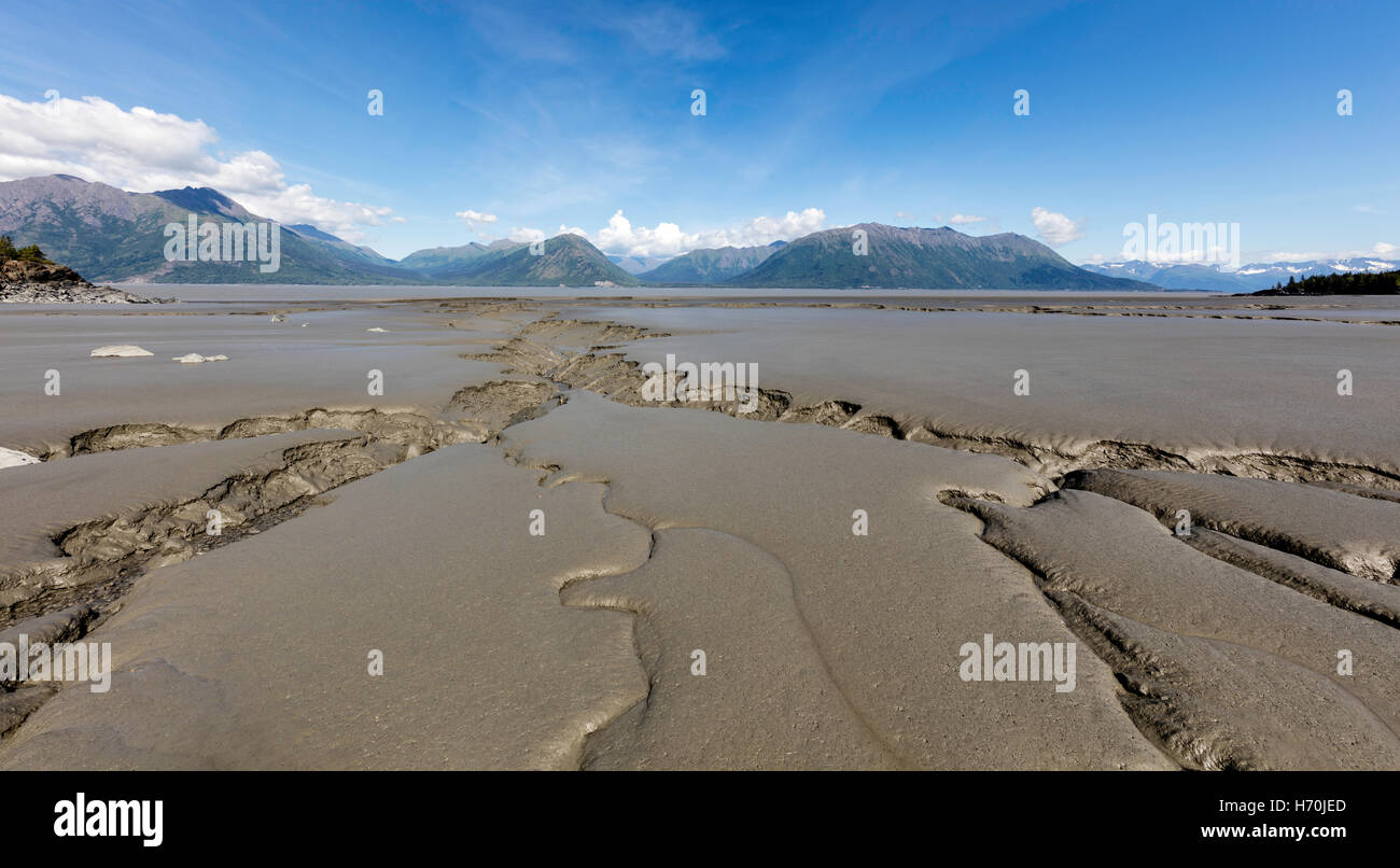 Tidal mudflats of Turnagain Arm looking toward the Chugach Mountains from Hope in Southcentral Alaska. Stock Photo