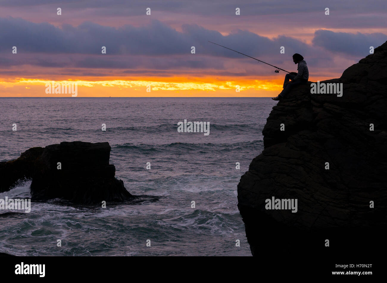 A man fishing on the coast of Chile Stock Photo