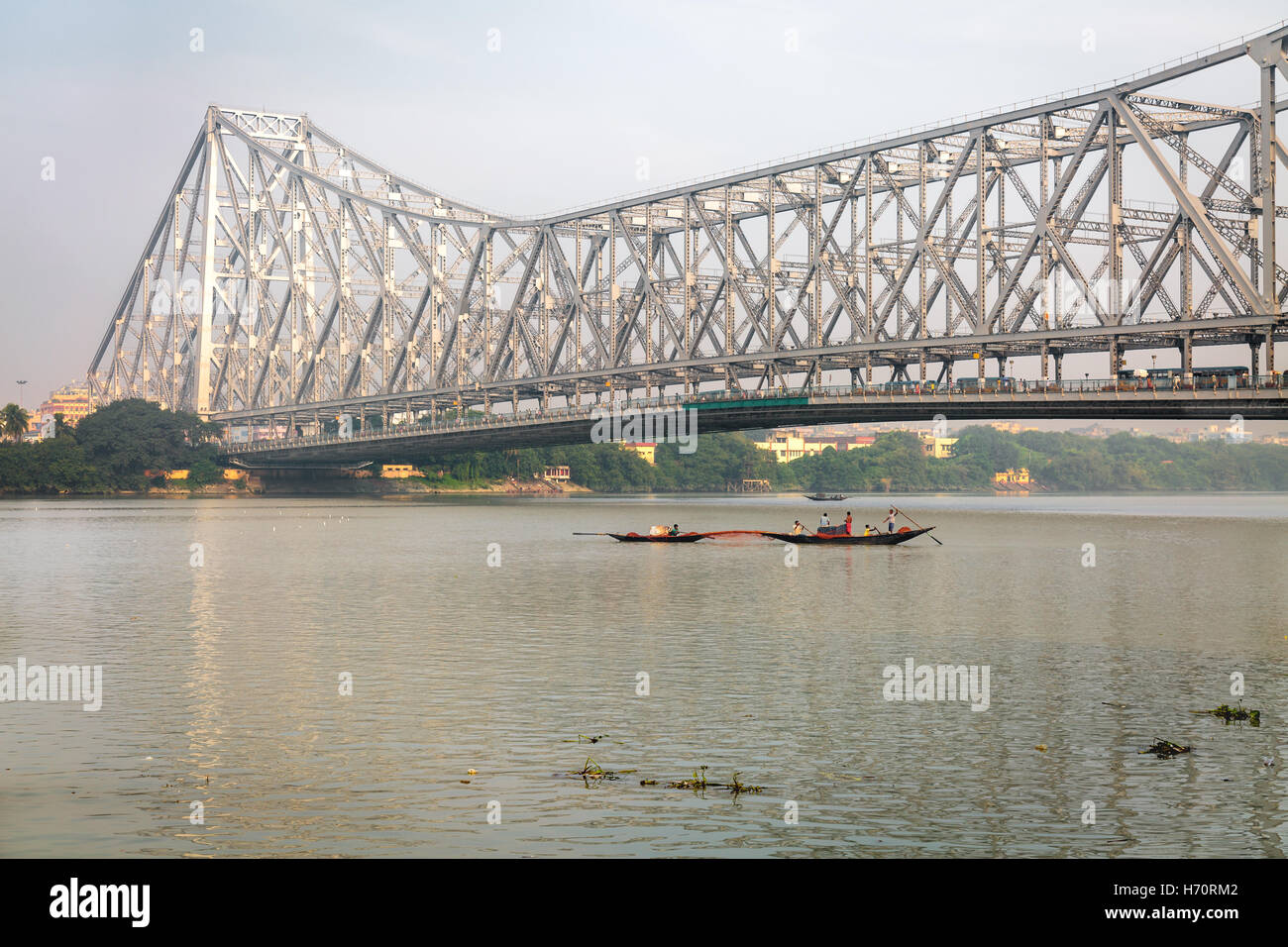 Historic Howrah bridge on the river Ganges. Howrah Bridge is a cantilever bridge with a suspended span over the Hooghly River. Stock Photo