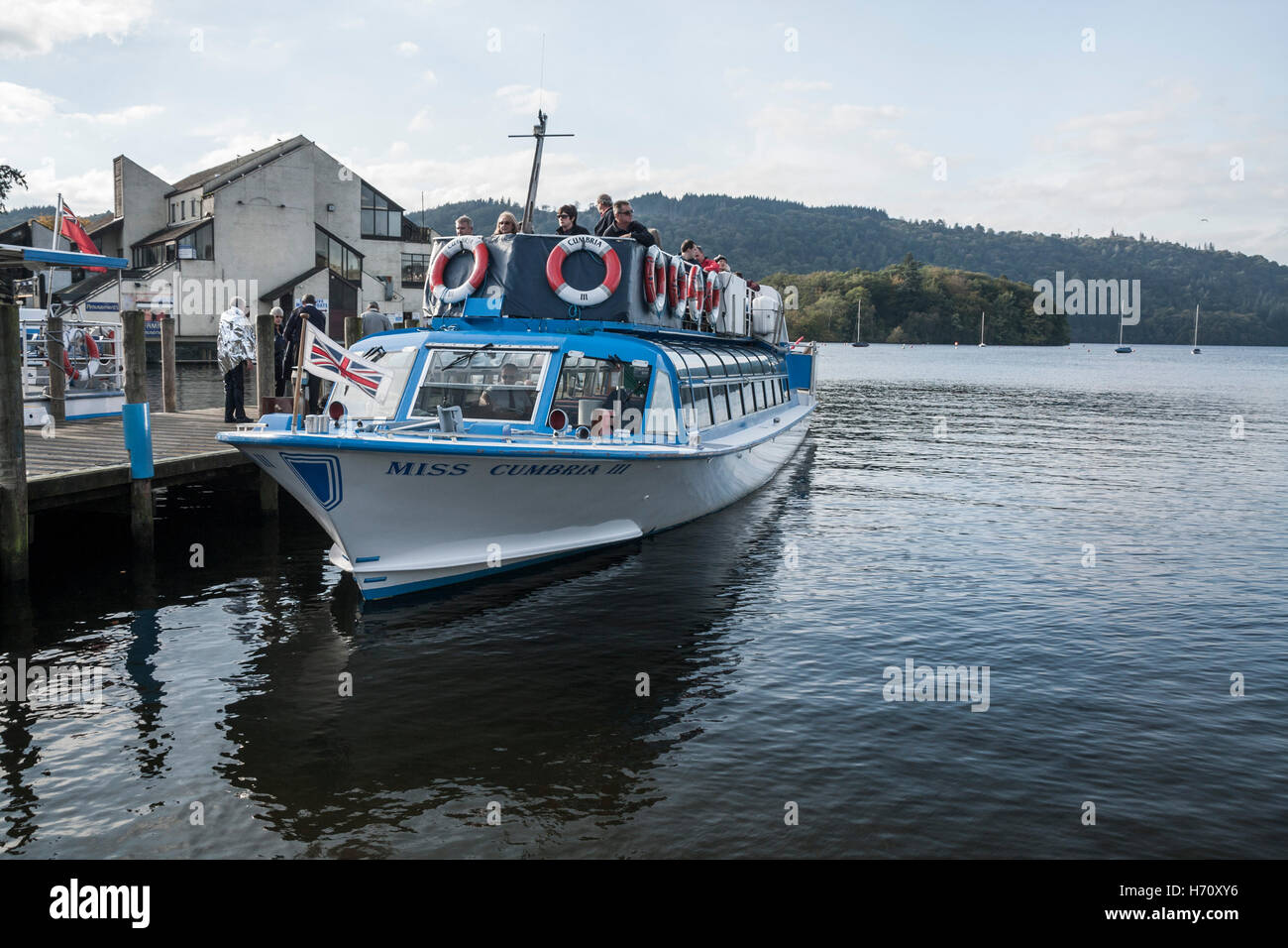 Tourists about to set off on a boat tour round Windermere in the Lake District National Park