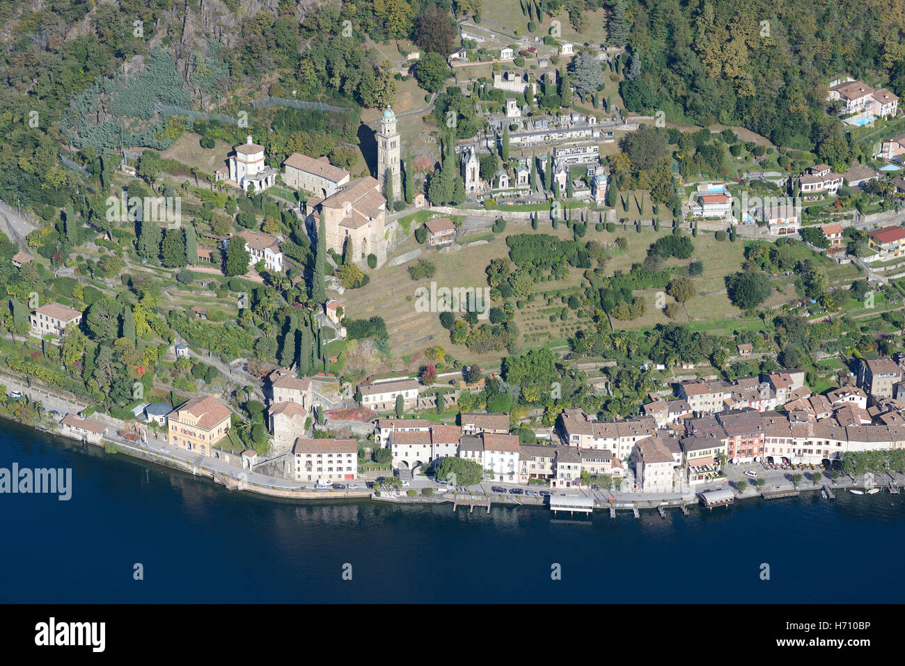 AERIAL VIEW. Picturesque lakeside town of Morcote. Lake Lugano, Canton of Ticino, Switzerland. Stock Photo