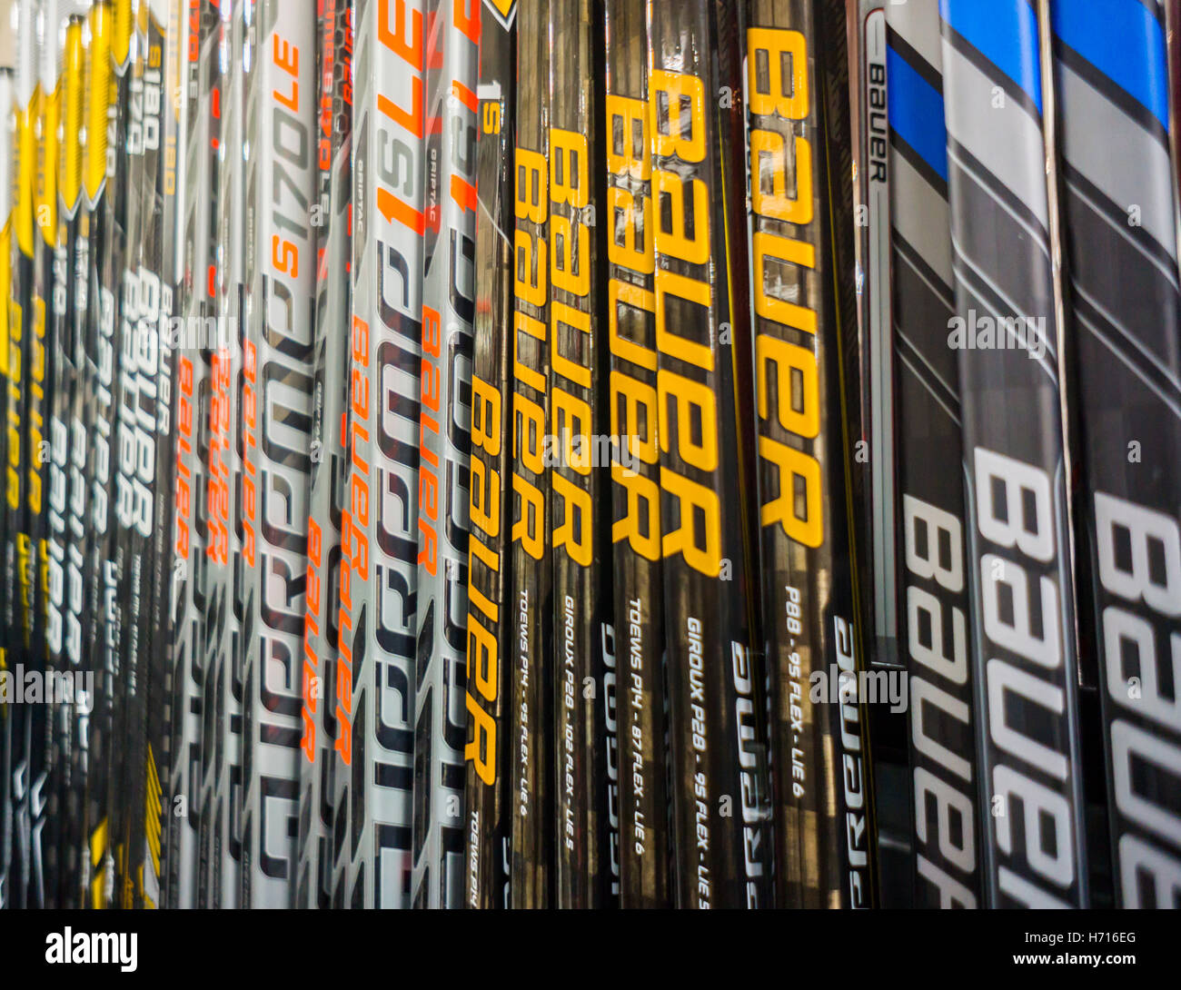 Bauer brand hockey sticks in a sporting goods store in New York on Monday,  October 31, 2016. Performance Sports Group, the owner of the Bauer ice  hockey brand and the Easton baseball