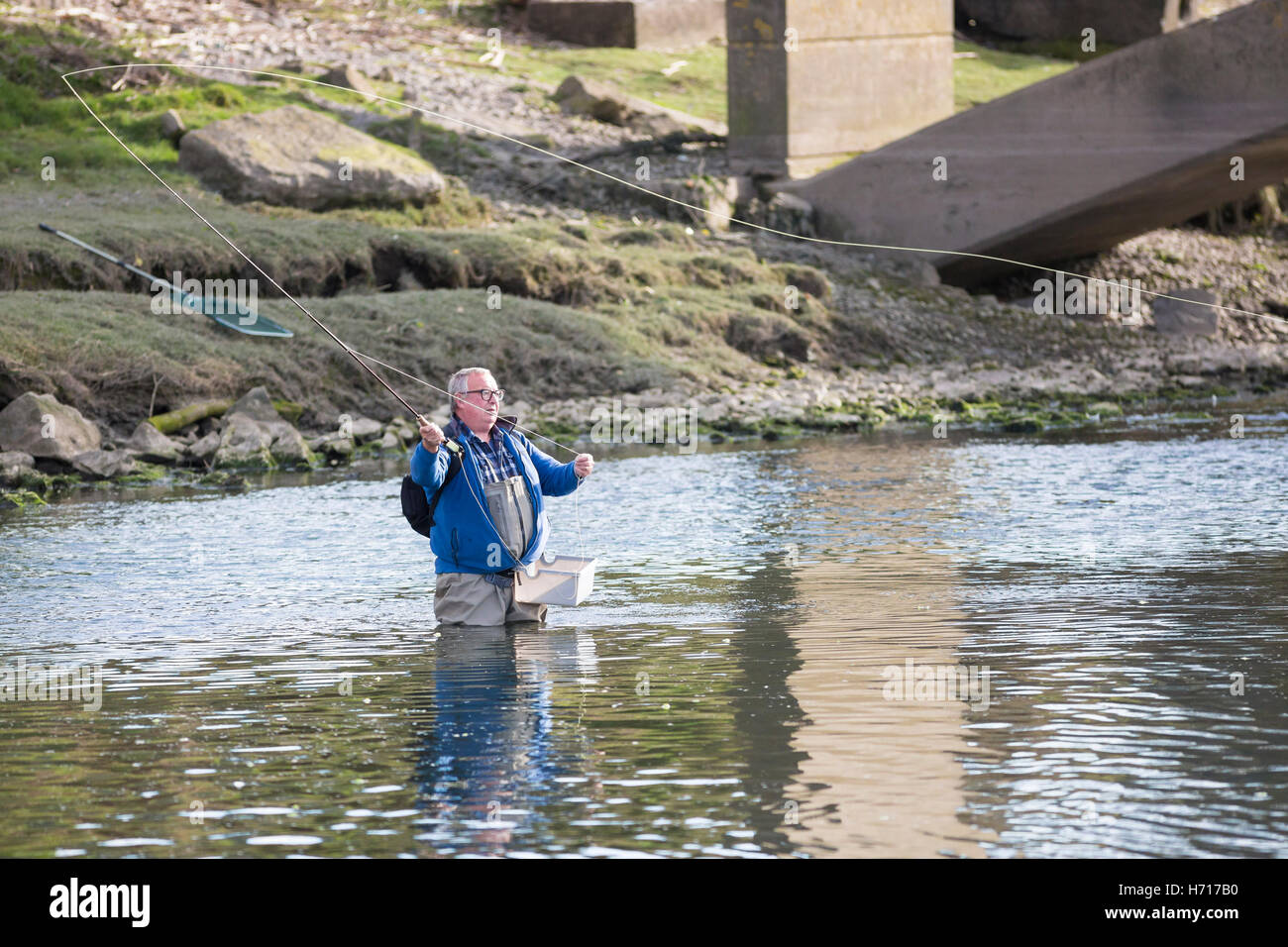 fly fisherman casting on river Stock Photo