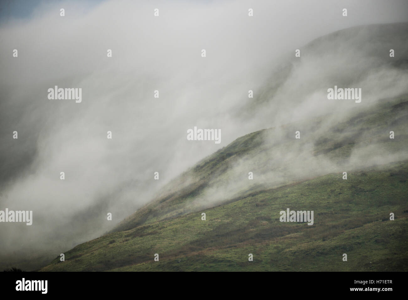 Unusual UK weather: Low mist and fog cascading over the hills near Cadair Idris, Snowdonia National Park, Wales UK Wales UK October 2016 Stock Photo