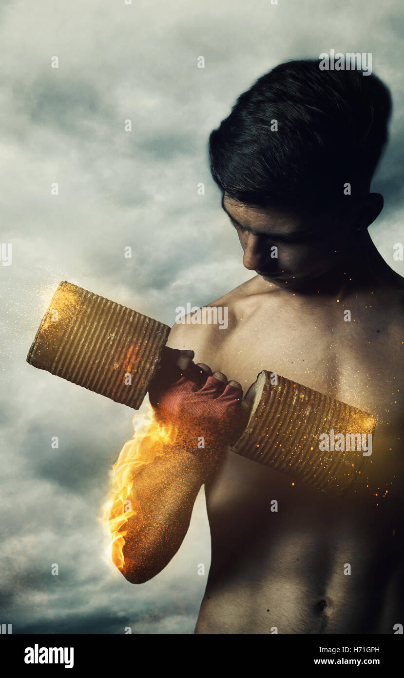 power athletic young bodybuilder doing exercises with fire hand and ...