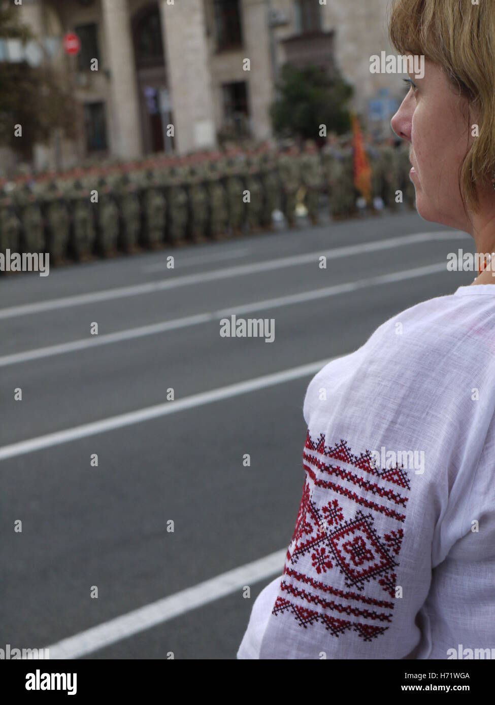 Ukrainian woman with traditional shirt is watching military parade in Kiev Stock Photo