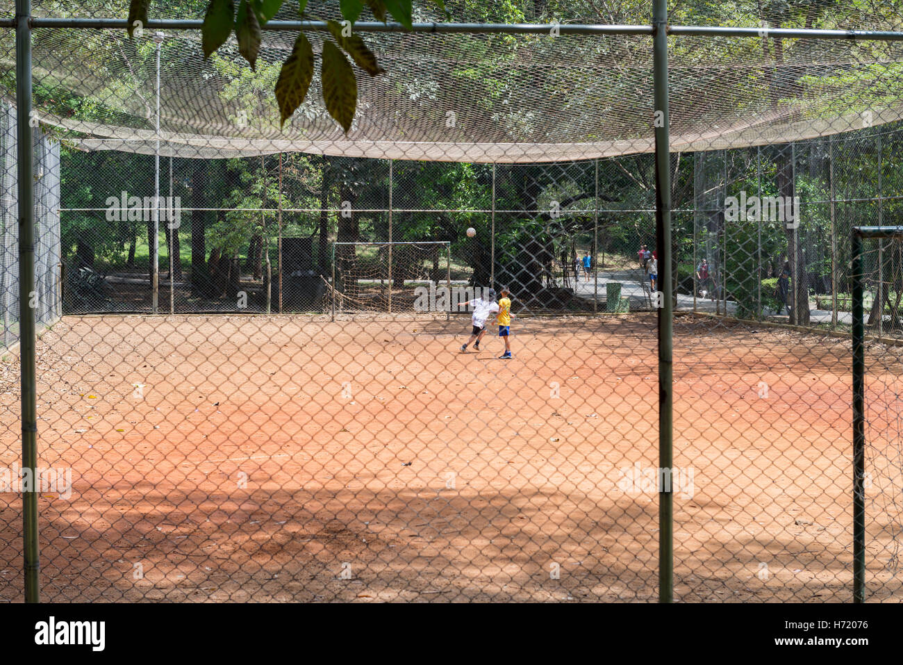 Sao Paulo, Brazil - October 15 2016: Kids playing football at the Aclimacao Park in Sao Paulo, Brazil. Stock Photo