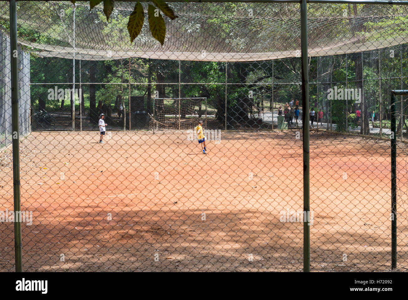 Sao Paulo, Brazil - October 15 2016: Kids playing football at the Aclimacao Park in Sao Paulo, Brazil. Photo series (2 of 8) Stock Photo
