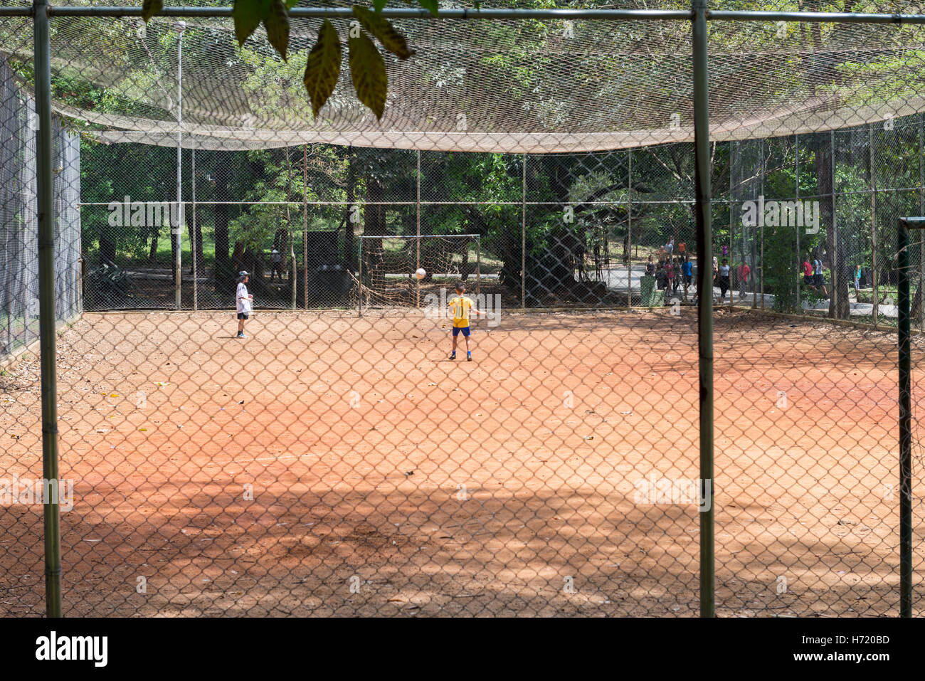Sao Paulo, Brazil - October 15 2016: Kids playing football at the Aclimacao Park in Sao Paulo, Brazil. Photo series (4 of 8) Stock Photo