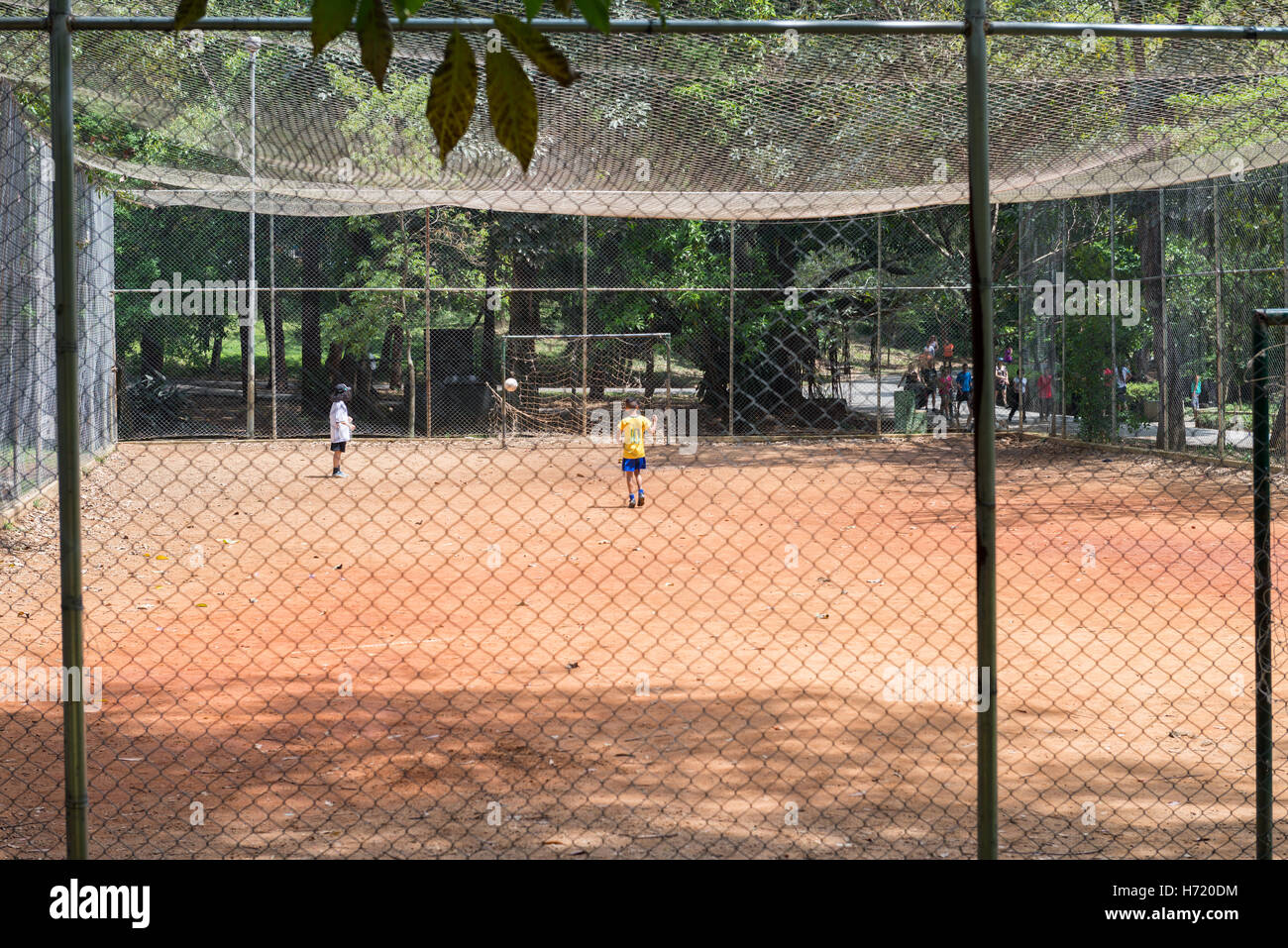 Sao Paulo, Brazil - October 15 2016: Kids playing football at the Aclimacao Park in Sao Paulo, Brazil. Photo series (6 of 8) Stock Photo