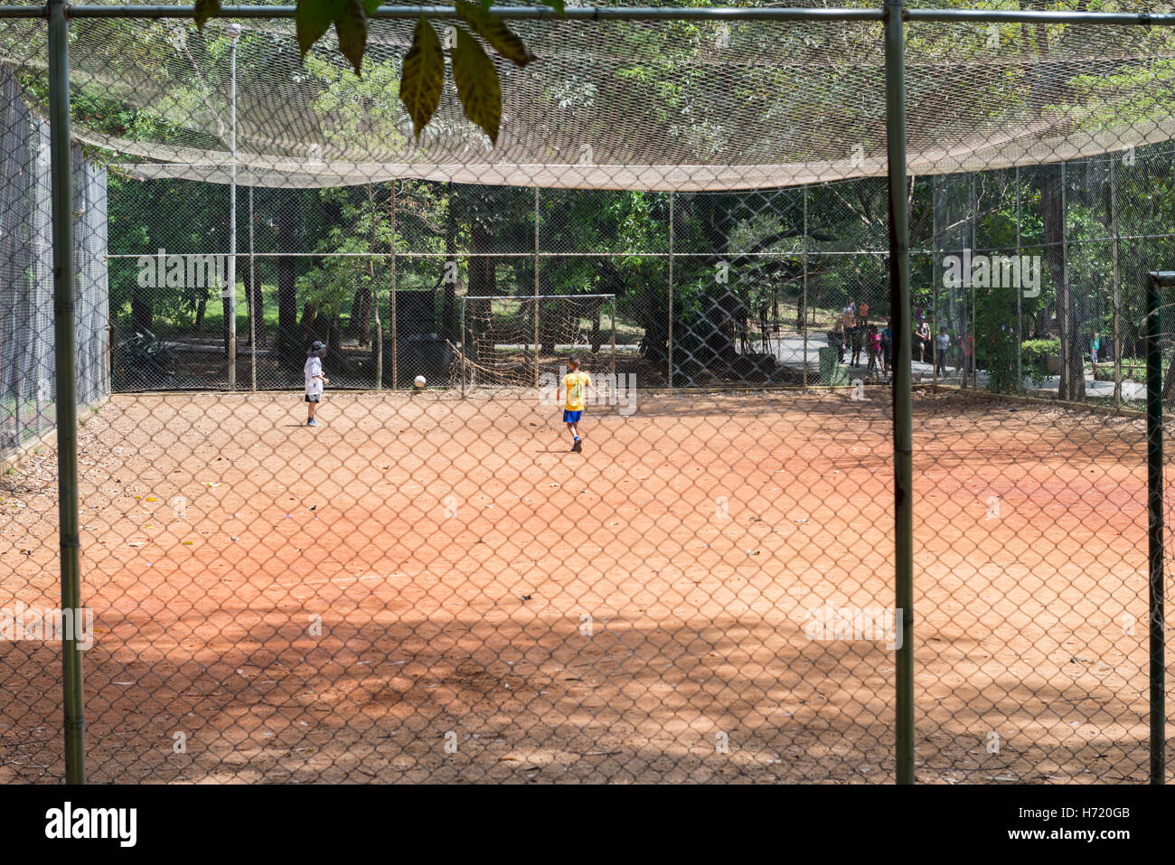 Sao Paulo, Brazil - October 15 2016: Kids playing football at the Aclimacao Park in Sao Paulo, Brazil. Photo series (8 of 8) Stock Photo