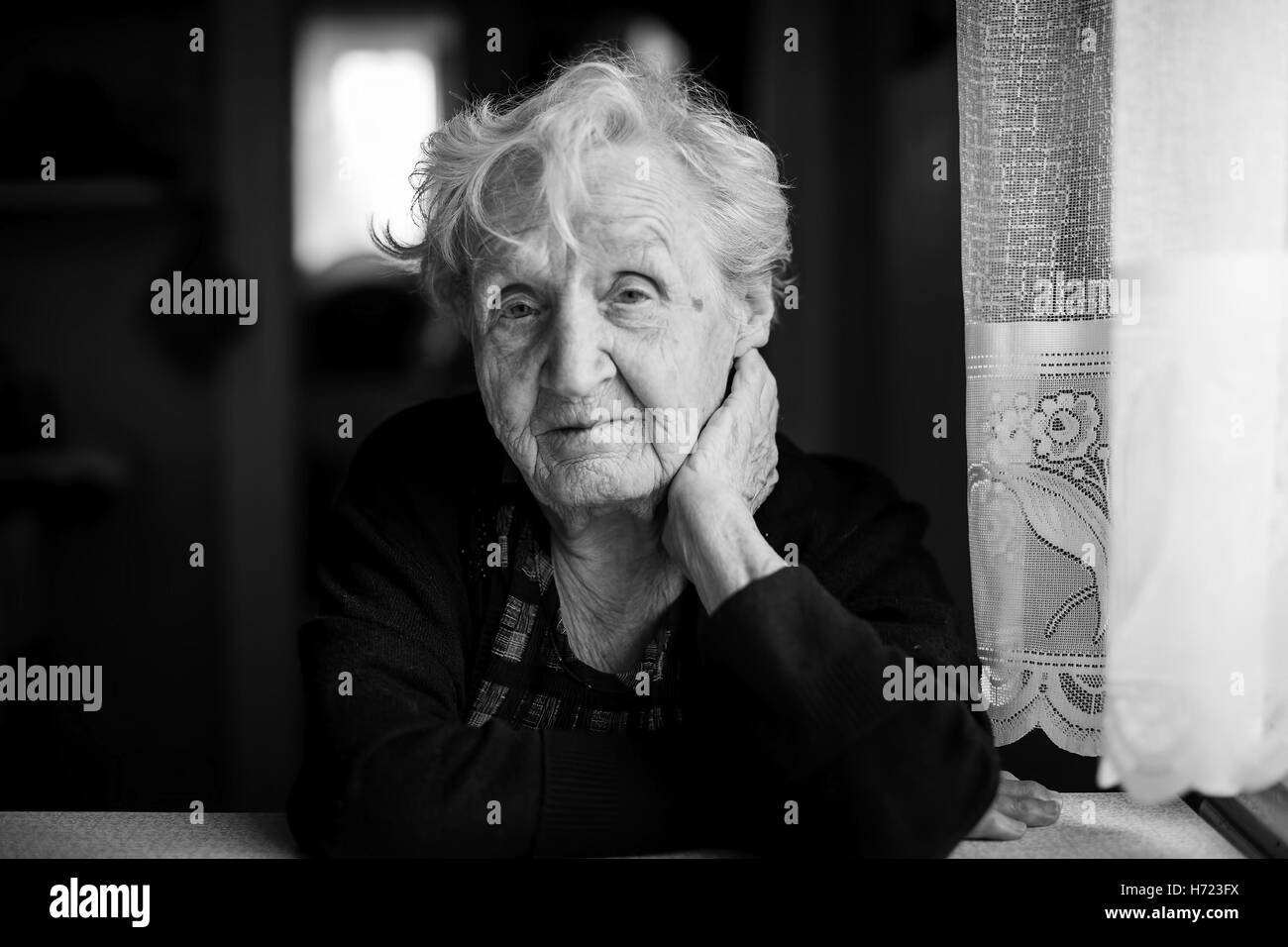 An elderly woman, black-and-white portrait. Stock Photo