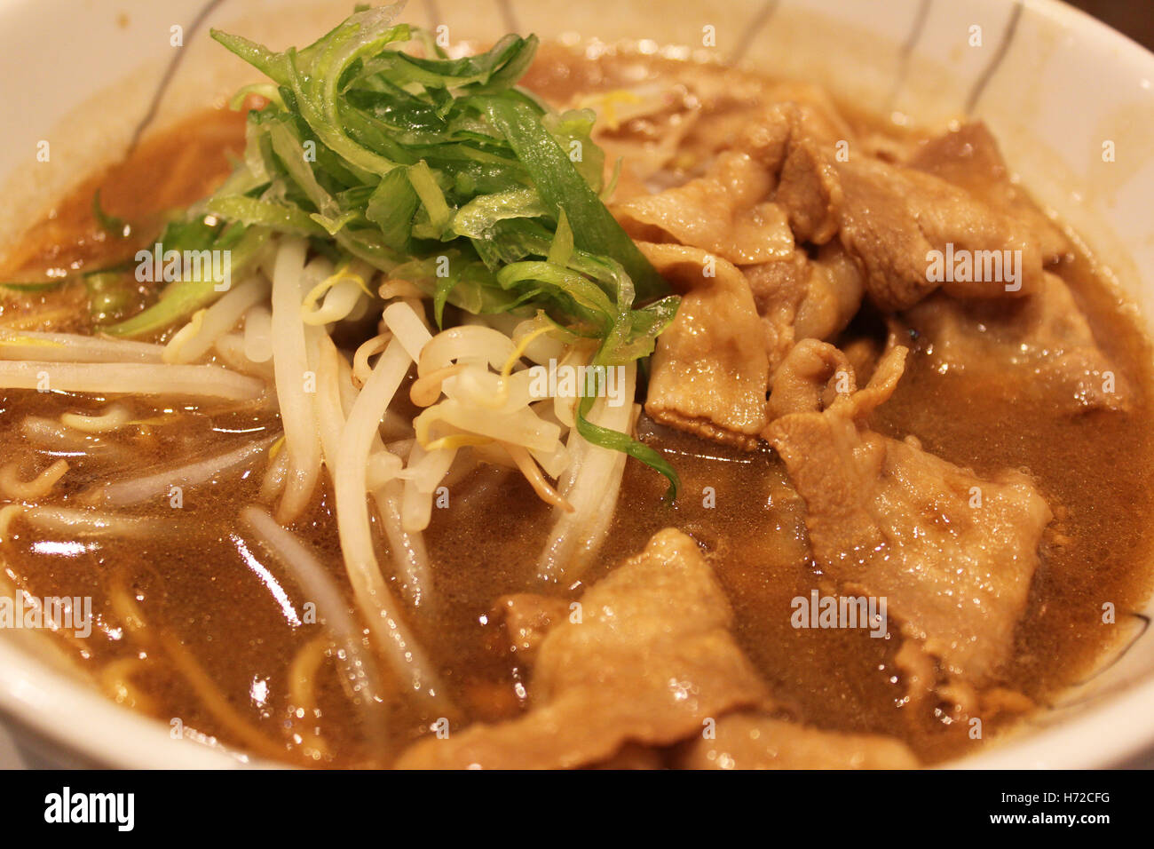 Japanese Ramen with sliced pork, green onion, bean sprouts and noodles