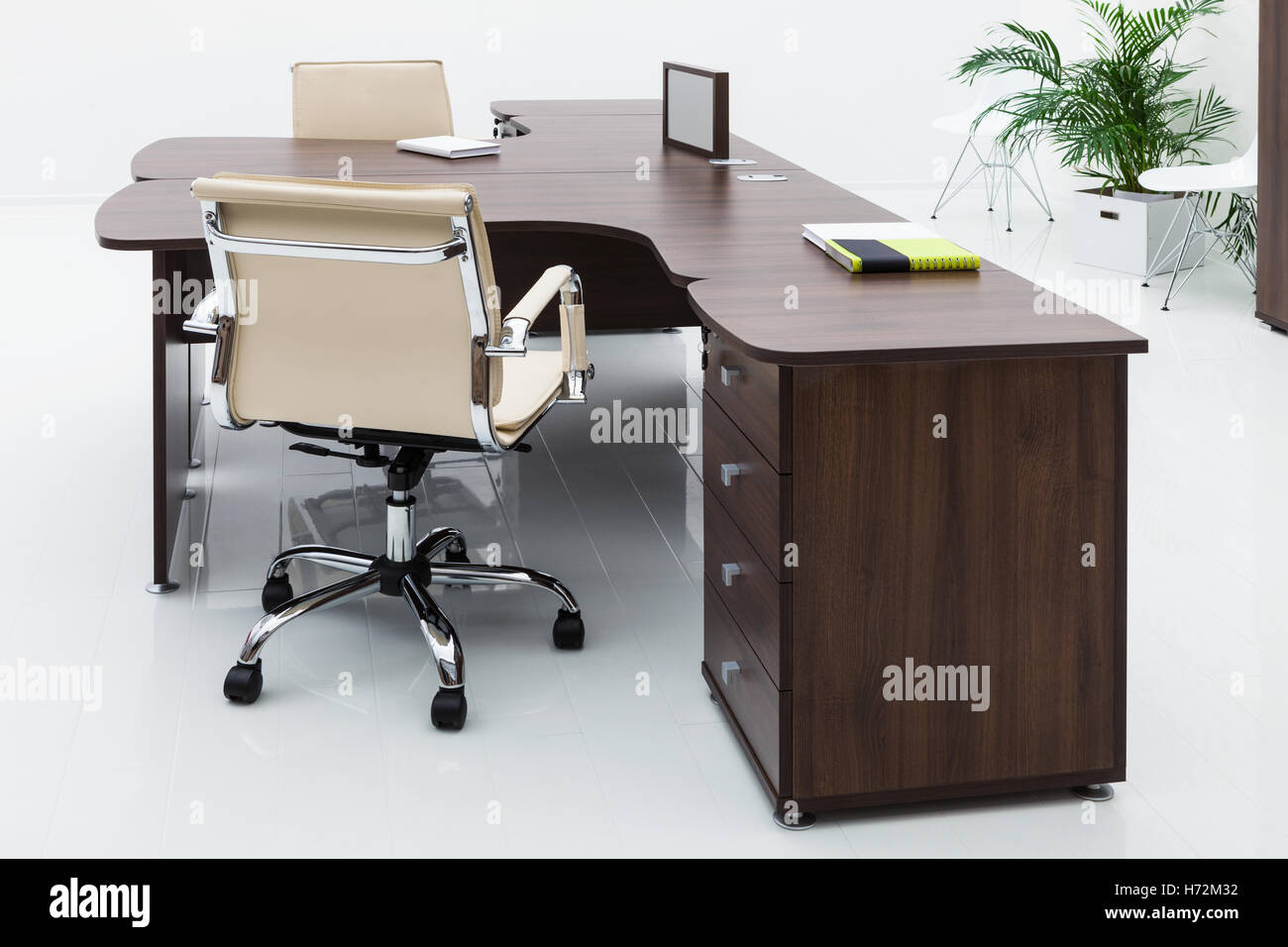 desks and leather chairs on a white wall Stock Photo - Alamy