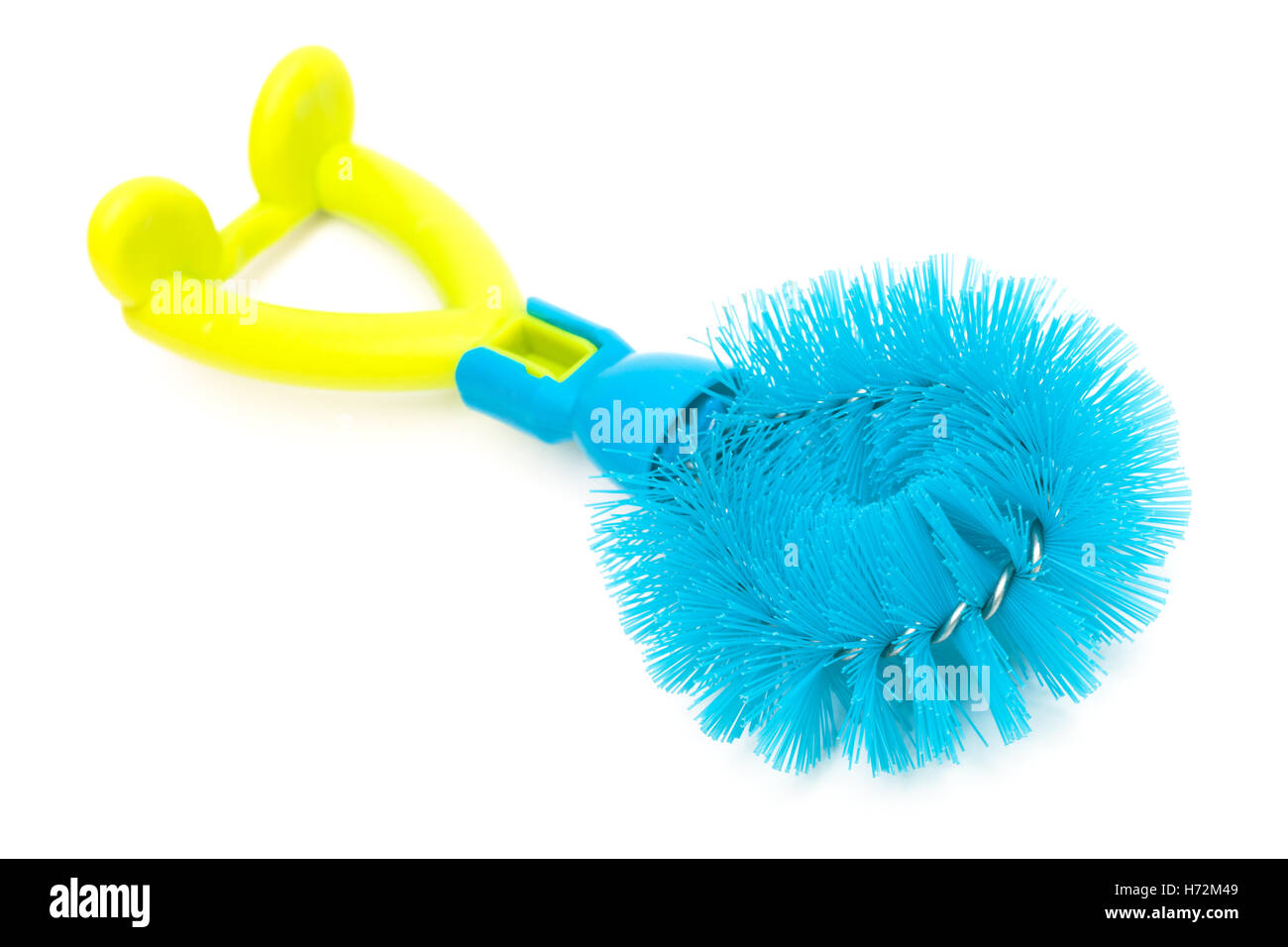 blue dishwashing brush on a white background Stock Photo - Alamy
