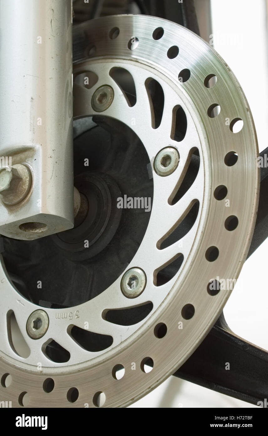 Standard ventilated motorcycle steel disc brake. Stock Photo