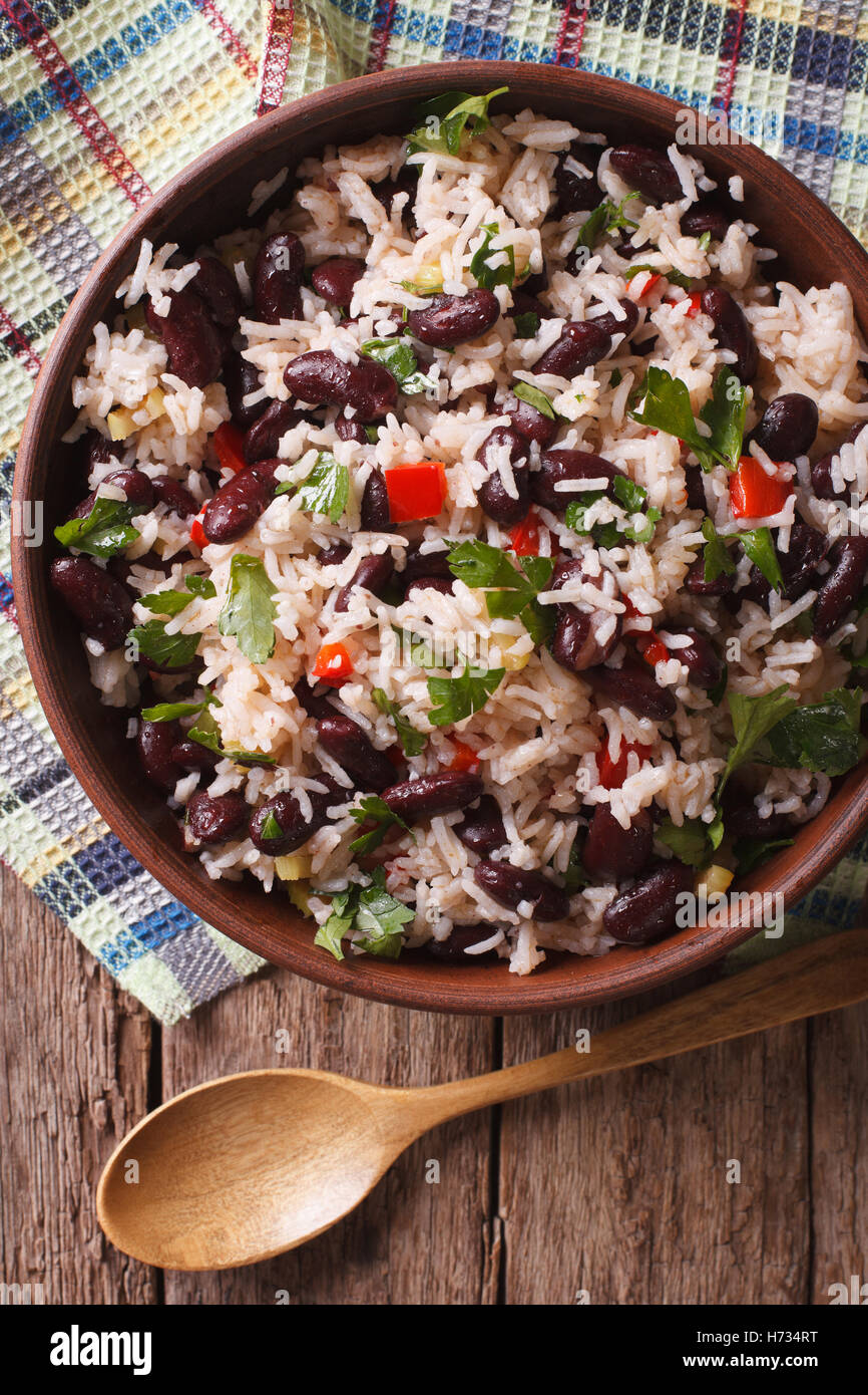 Rice with red beans and vegetables in a bowl close-up on the table. vertical view from above Stock Photo